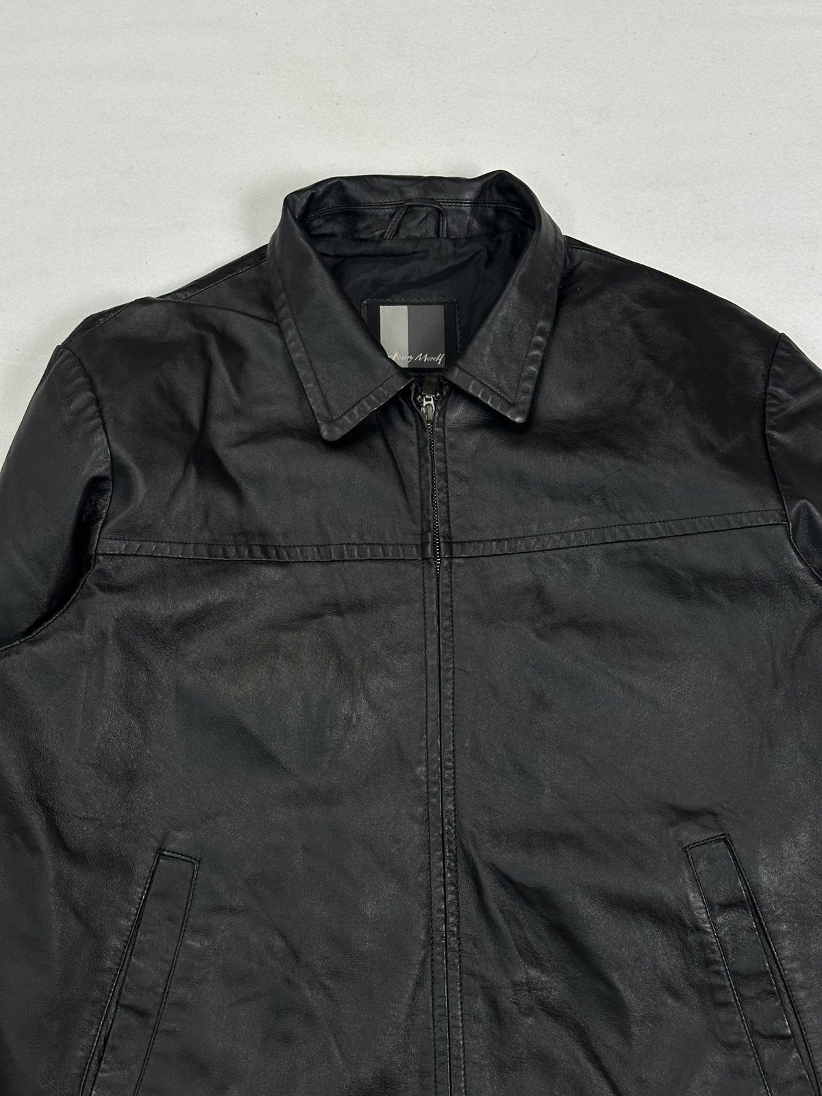Upper front showing the shirt collar and the yoke seam across the chest