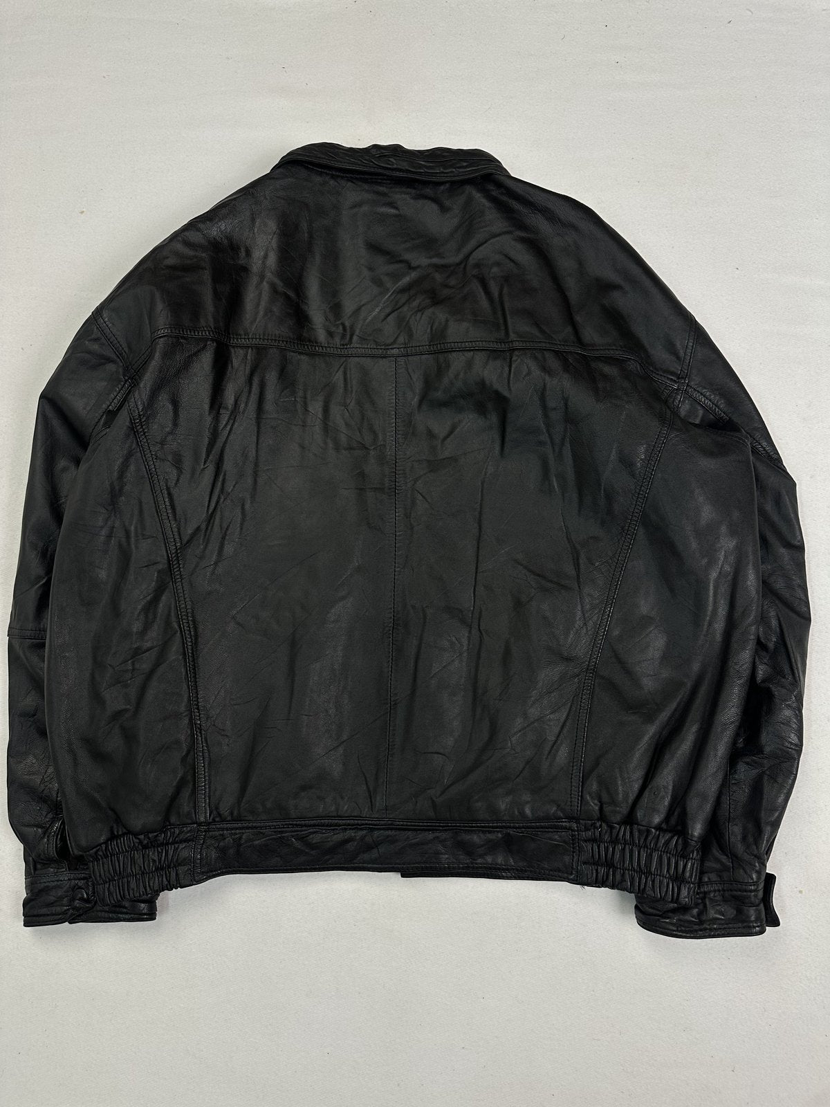 Wide shouldered black leather jacket in size XXL, 24 inches across