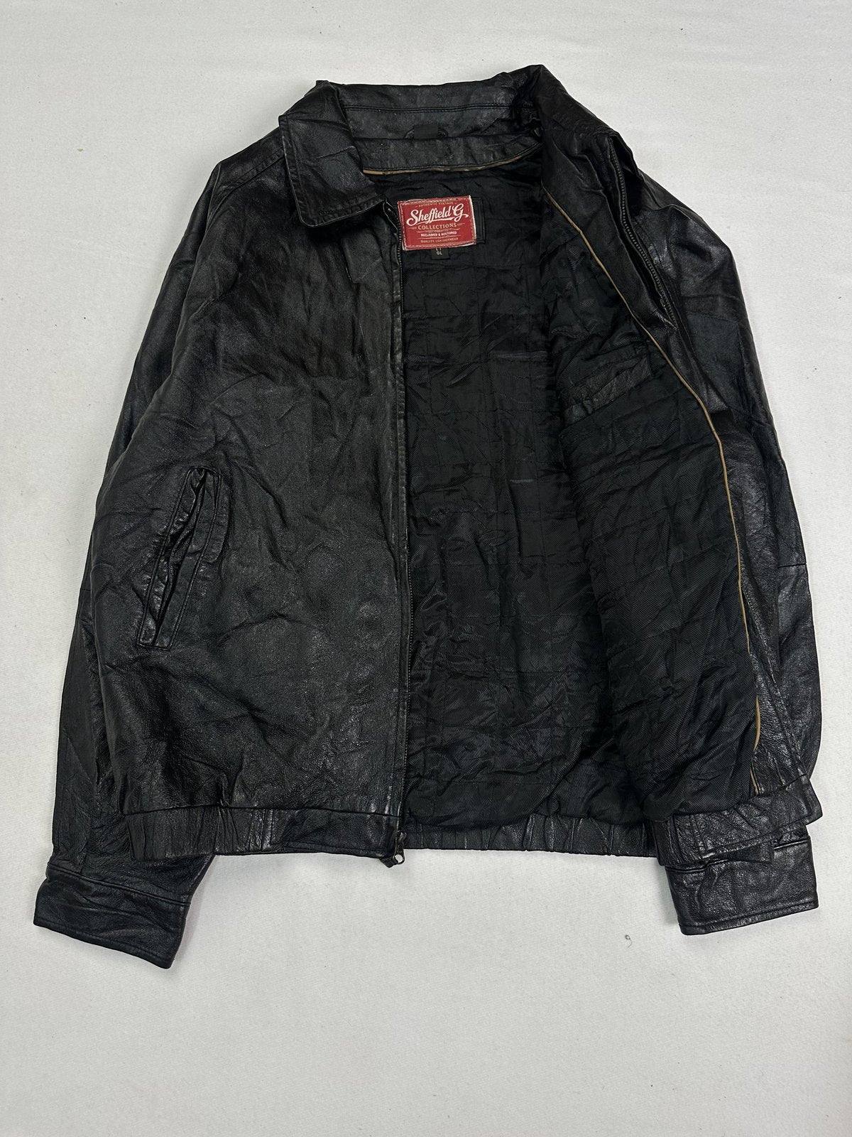 The size XL black harrington, 26 inches long through the body