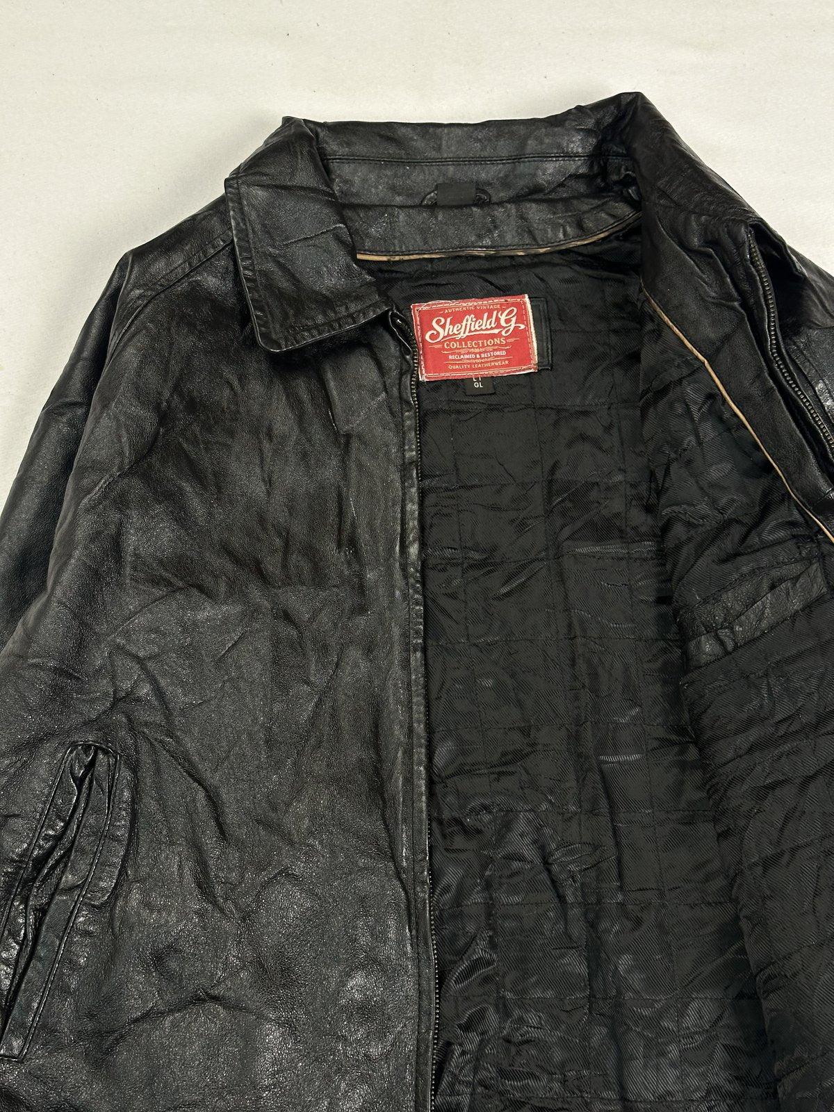 Black real leather harrington with a 22 inch sleeve, size XL