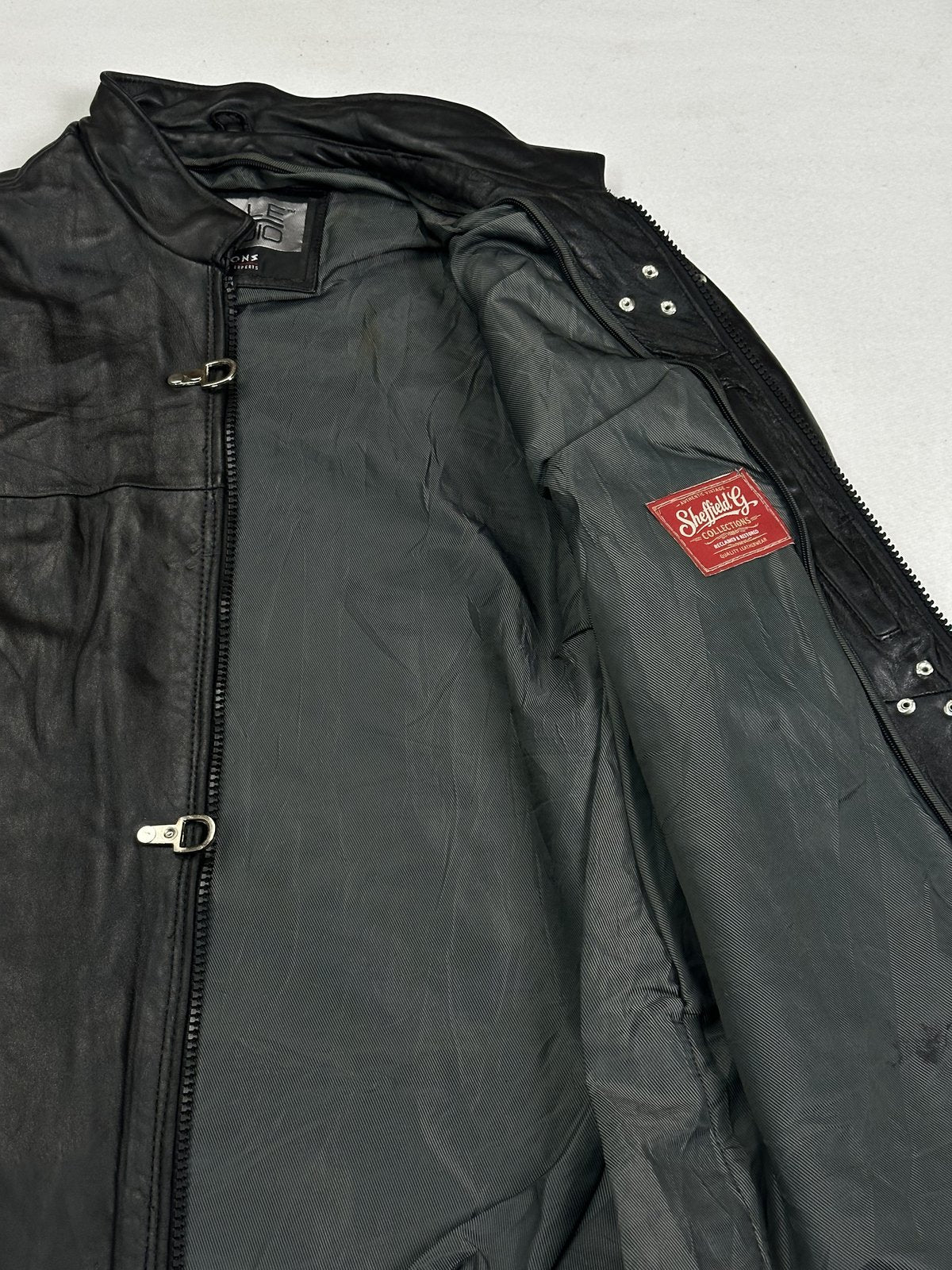 Long black real leather jacket with a 25 inch sleeve, size L