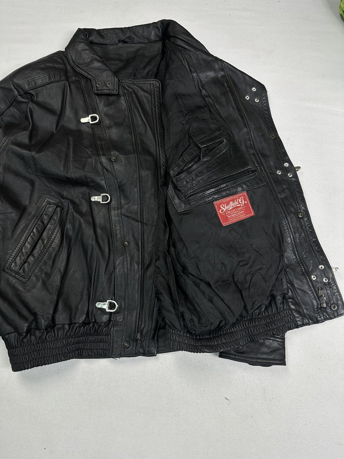 Bomber held open to show the dark lining and the large flap pocket on the inside