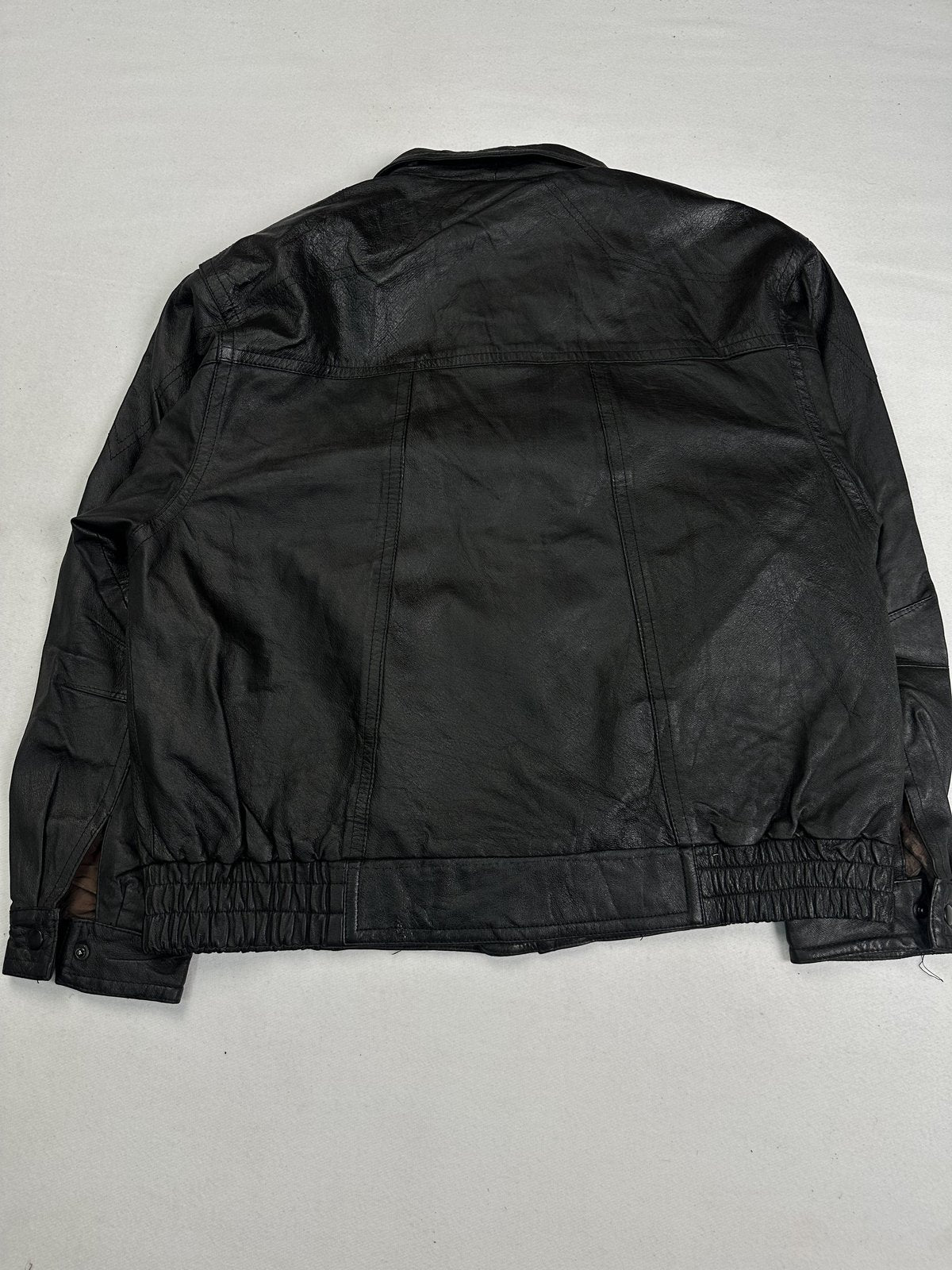 Black leather jacket in size XL with padded pocket detailing