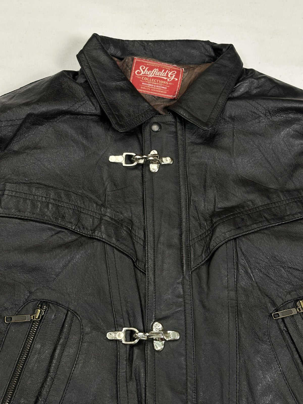 The size XL black jacket, 25 inches long through the body
