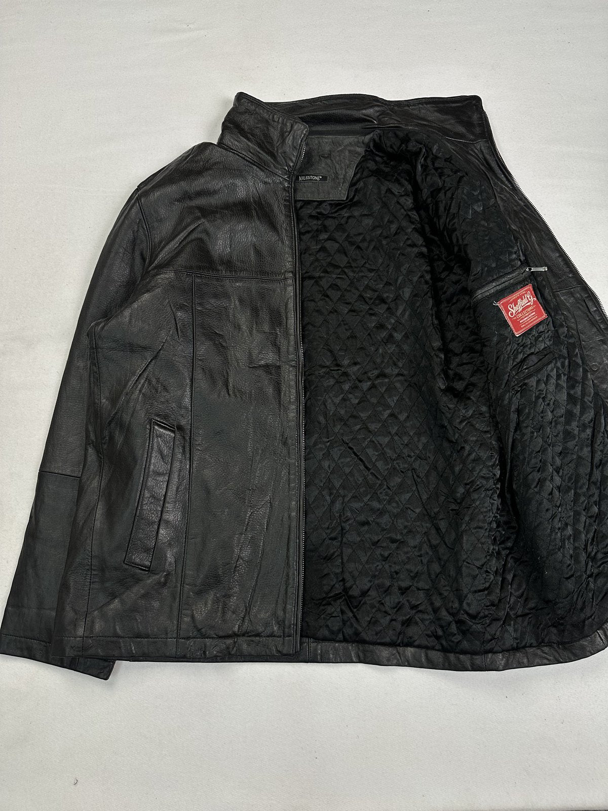 Black real leather cafe racer with a 25 inch sleeve, size XL