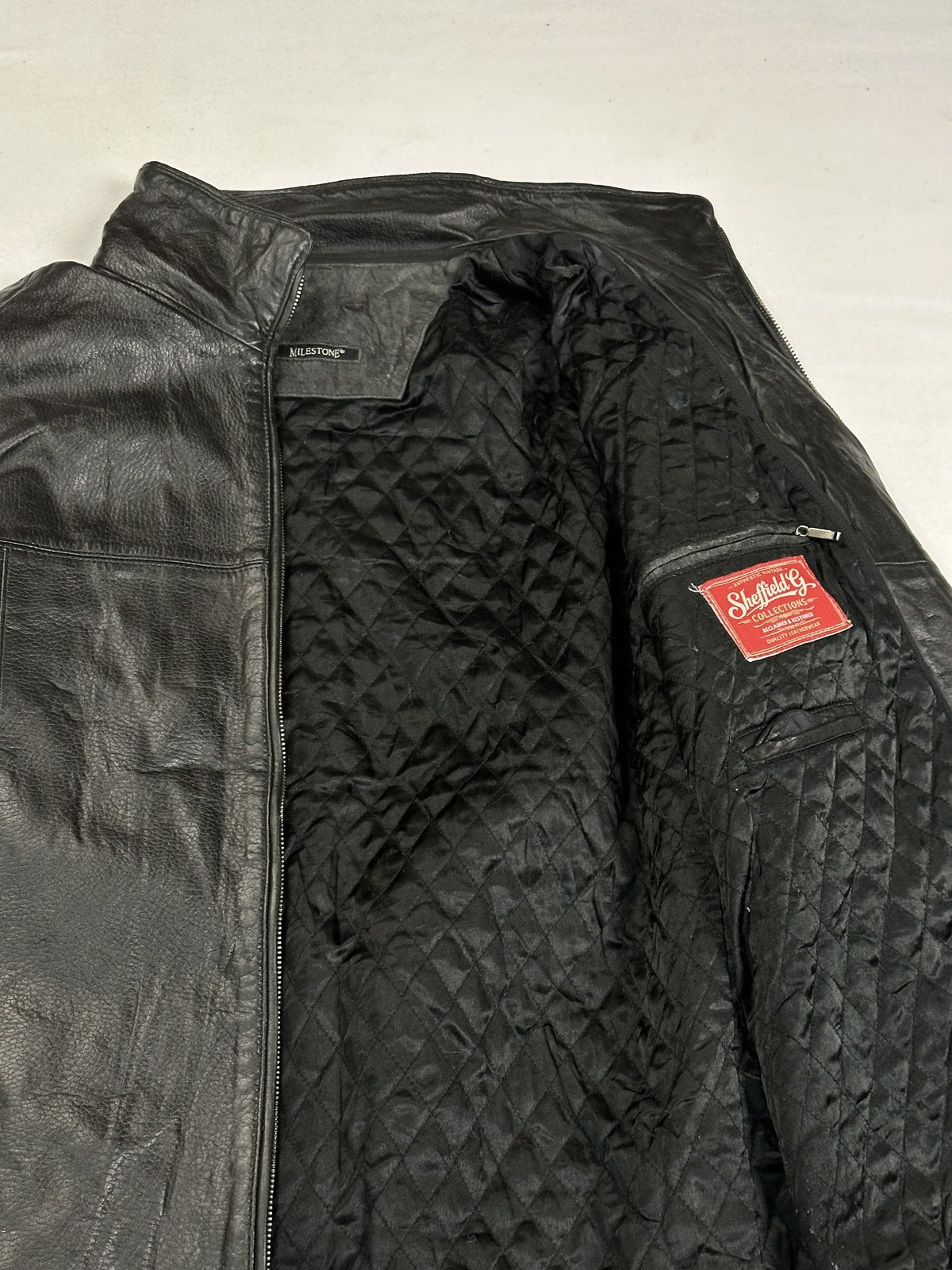 Longer line black leather jacket in size XL with a zipped front