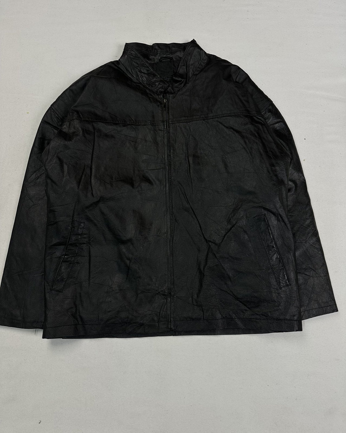 Black leather cafe racer jacket in size XL with minimal hardware