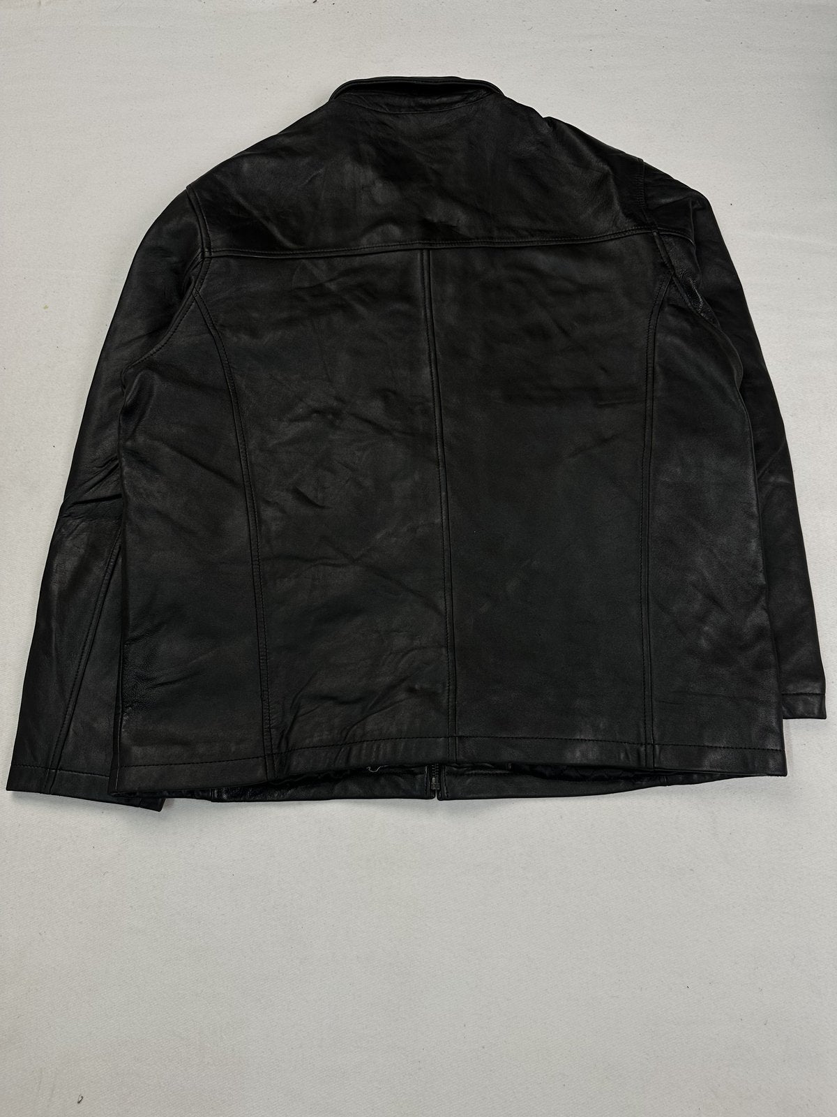 Buckle clasp fastening set against the black leather of the XL jacket