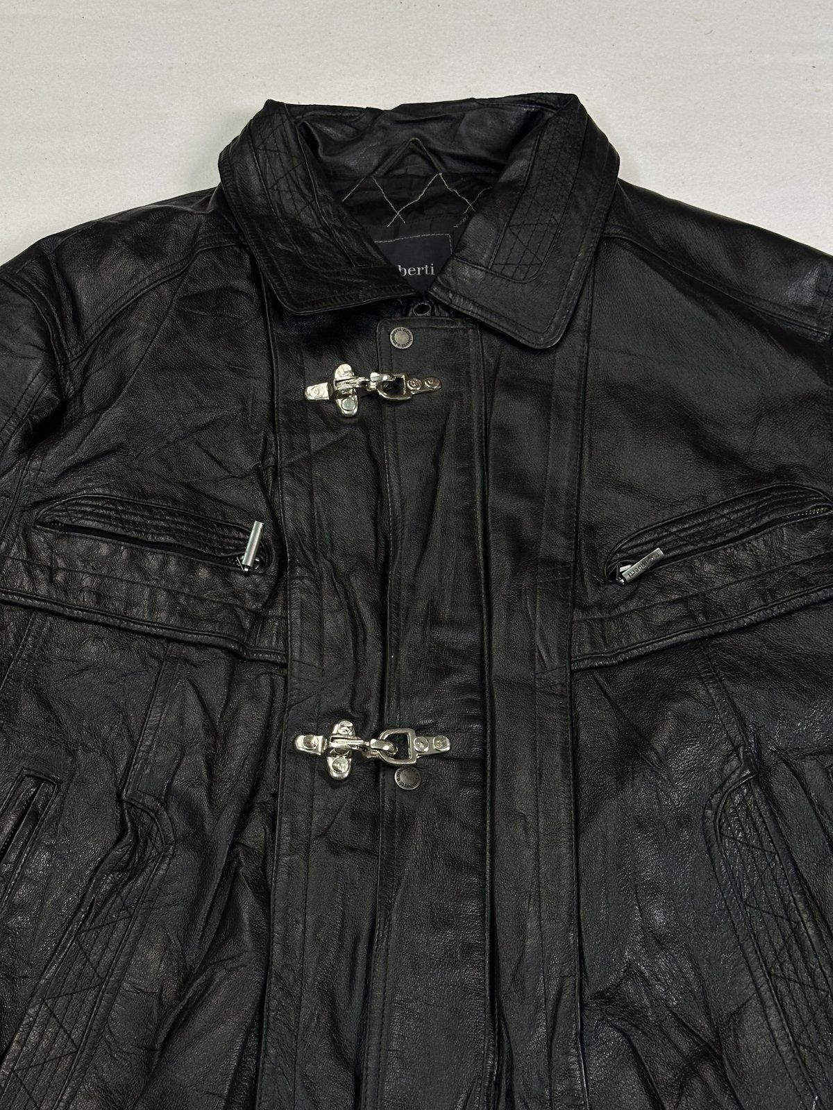 Close view of the flat shirt collar and the zipped chest pockets on this vintage jacket