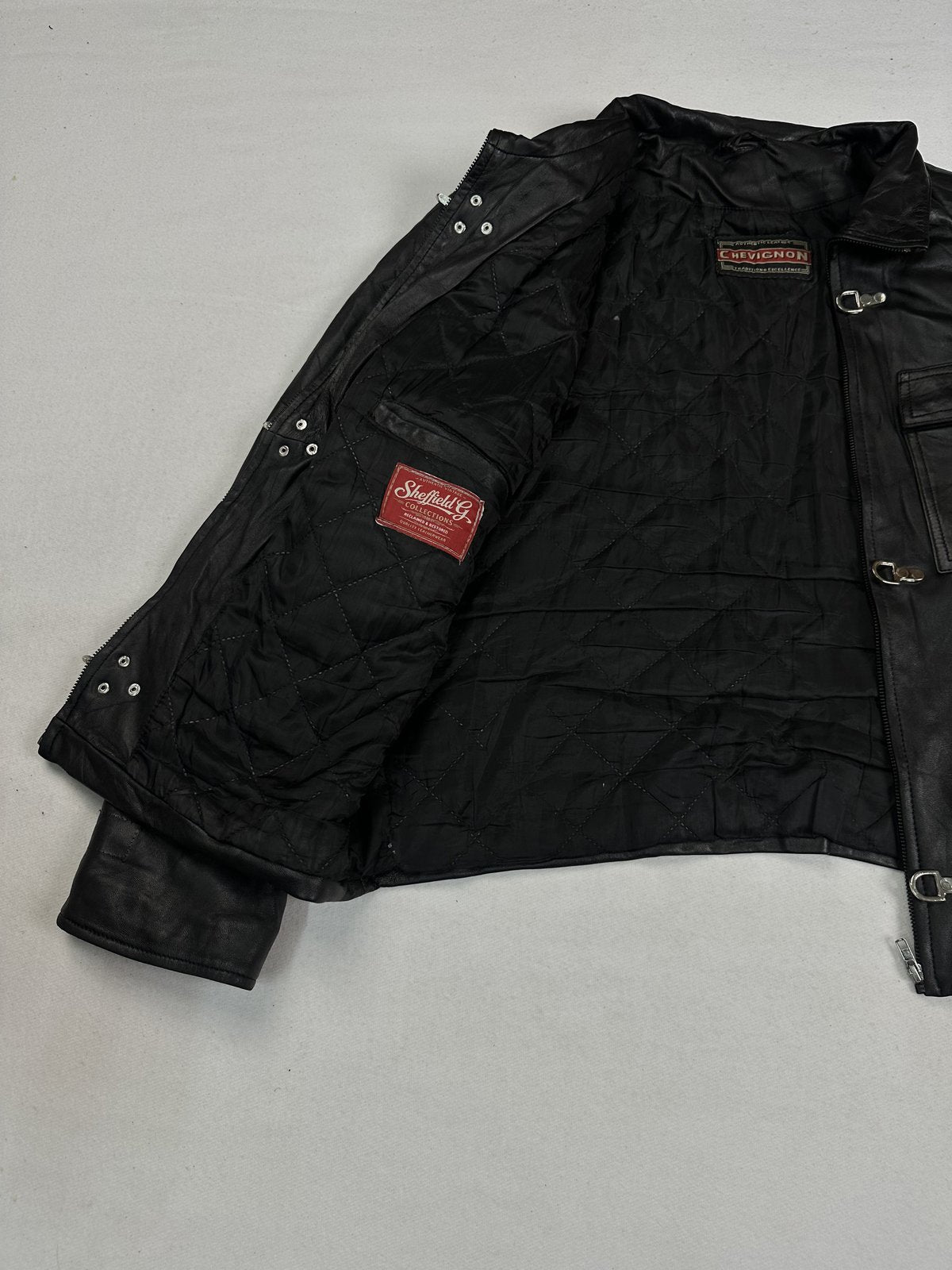 Black real leather field jacket with a long 26 inch sleeve, size L