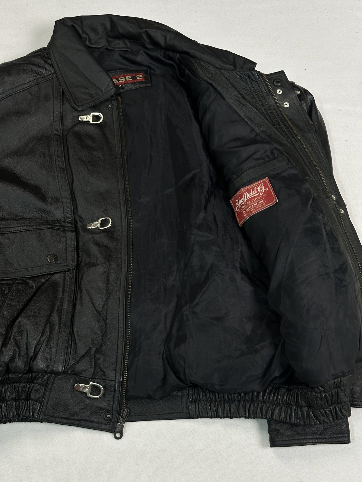Black real leather jacket with a 23 inch sleeve, size XL