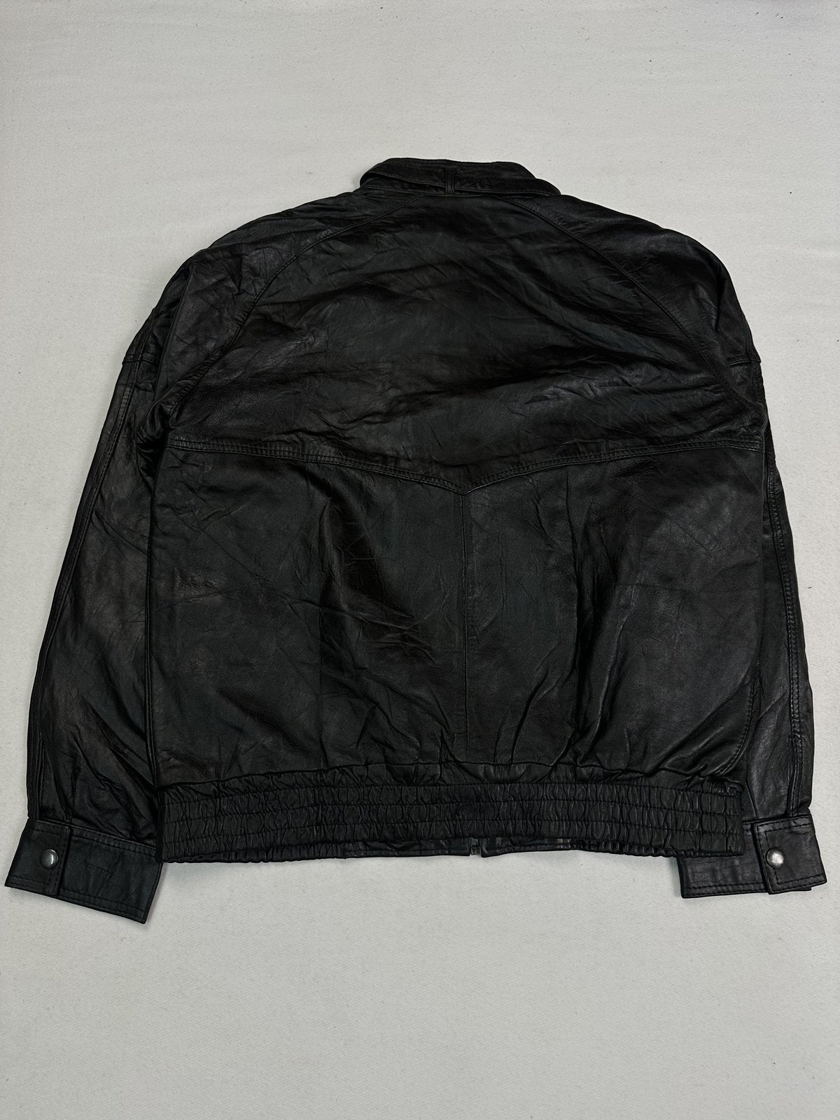D-ring detail fitted to the collar of the black leather jacket