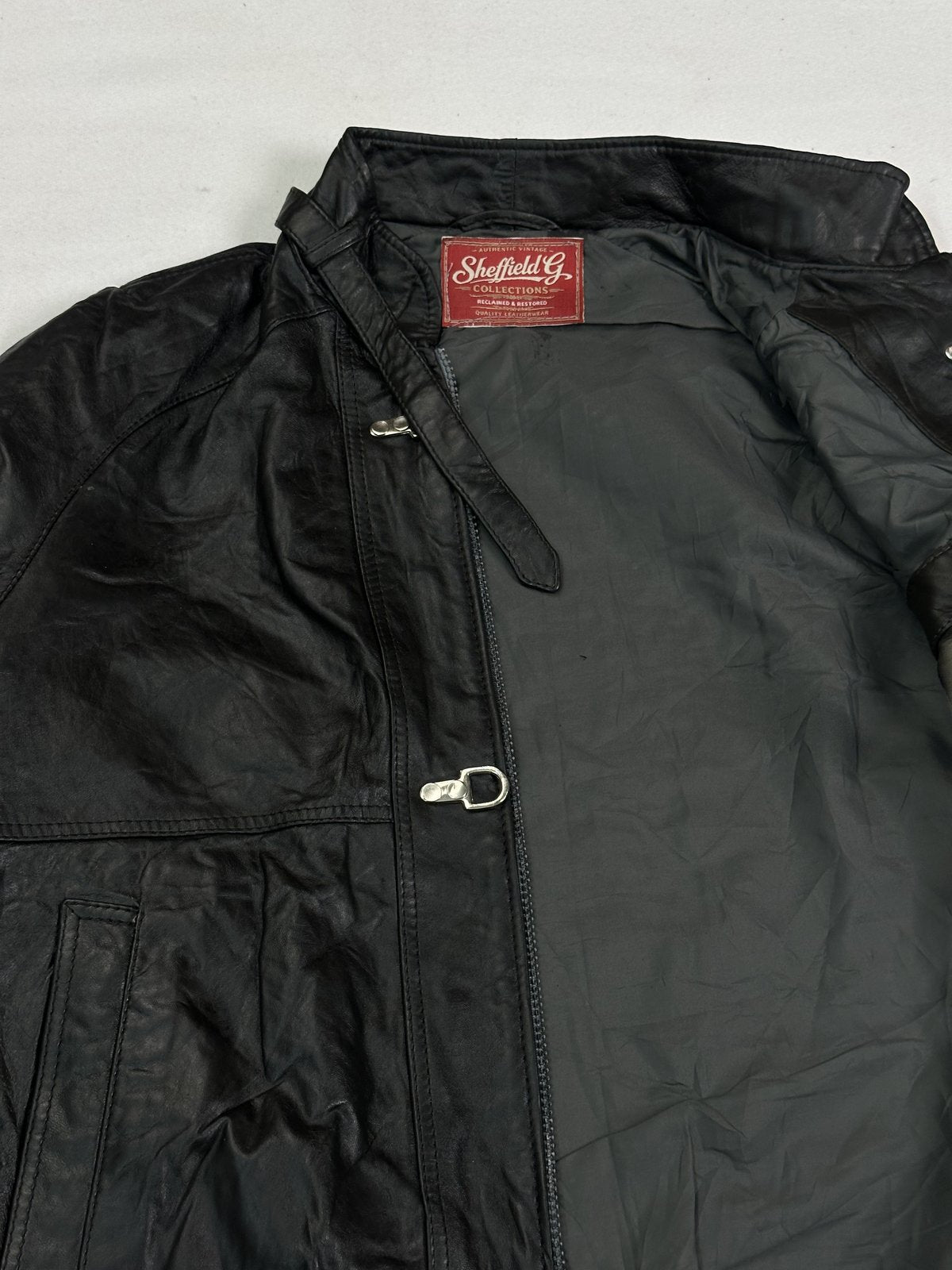 Black real leather jacket with a short 19 inch sleeve, size L