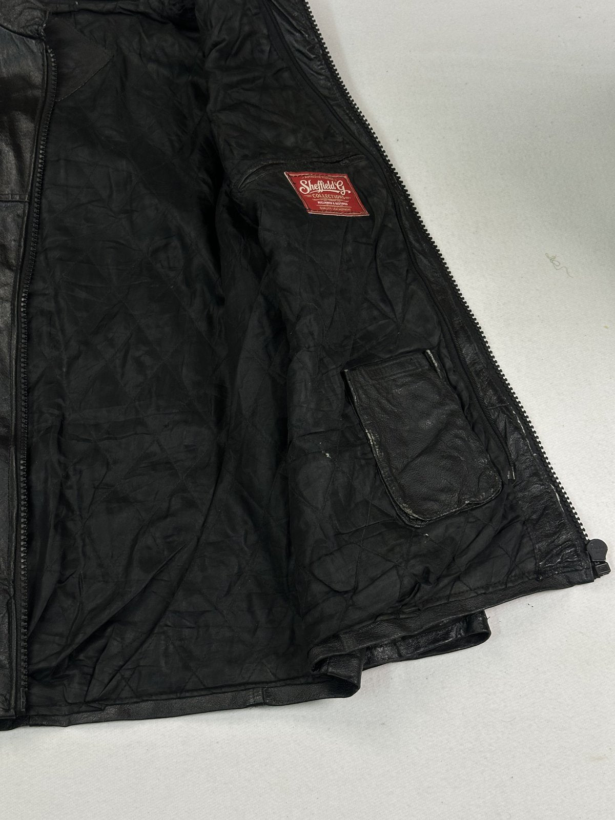 Black real leather cafe racer with a 23 inch sleeve, size L