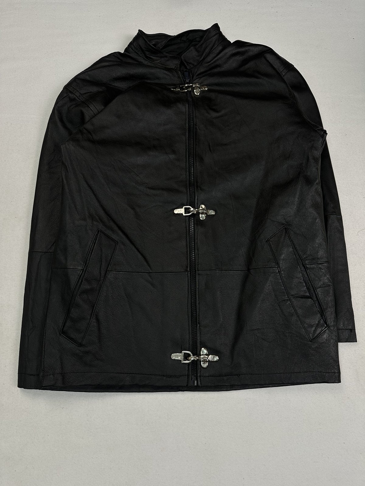 Black leather vintage jacket in size L shown from the front with its long cut and hook clasps