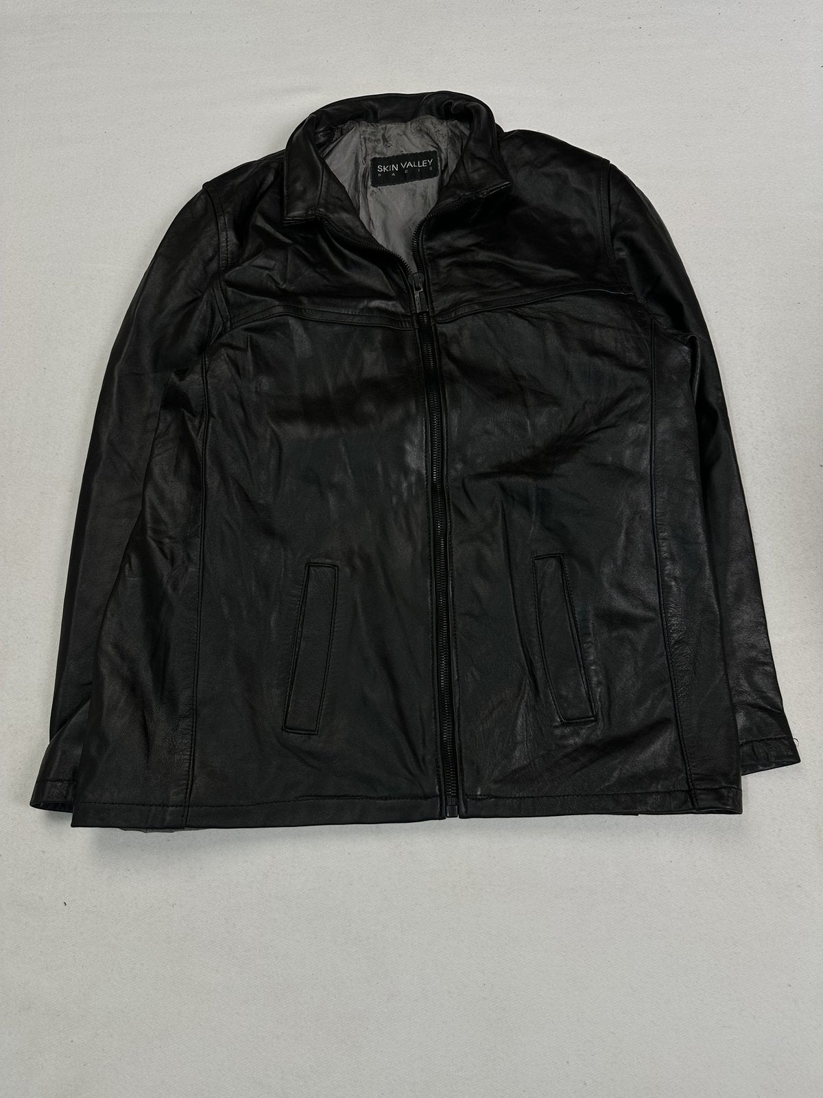 Black leather cafe racer jacket in size L with a fold-over collar
