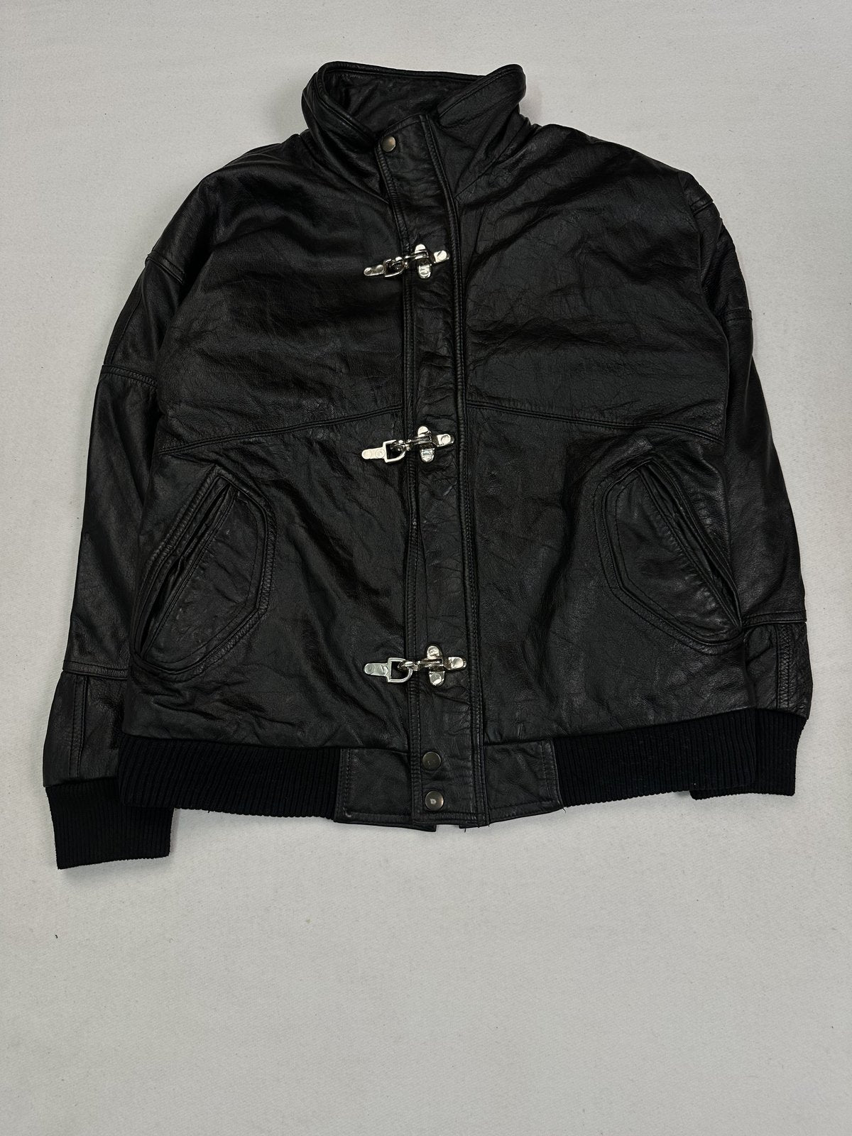 Black leather bomber jacket in size M with ribbed knit cuffs and hem