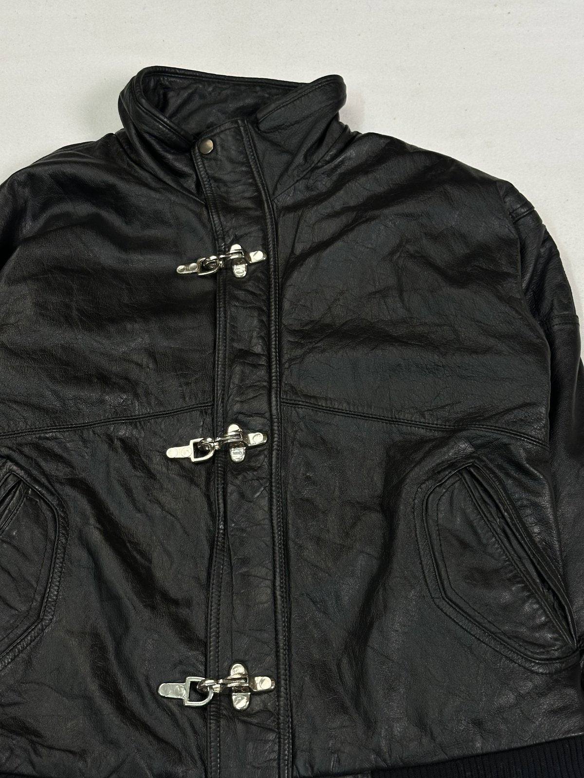 Black leather bomber jacket in very good condition, shown in size M