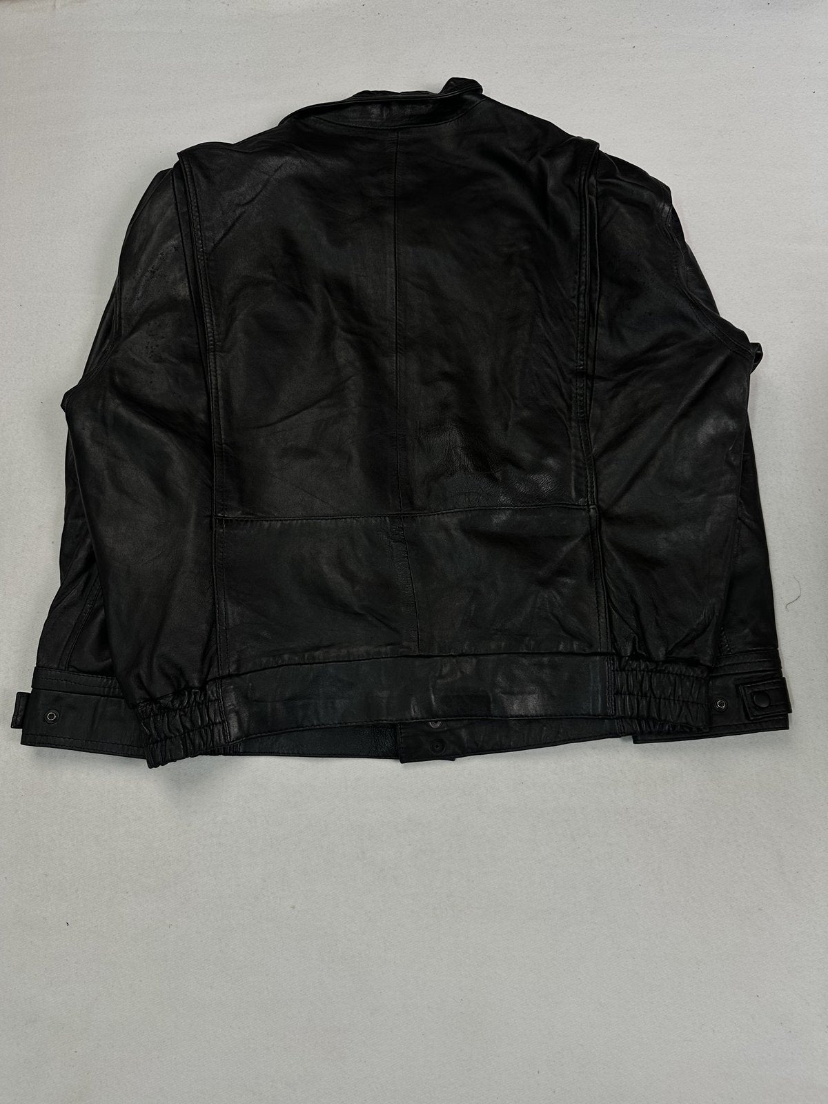 Back of the roomy XXL black jacket laid flat showing the elasticated waistband