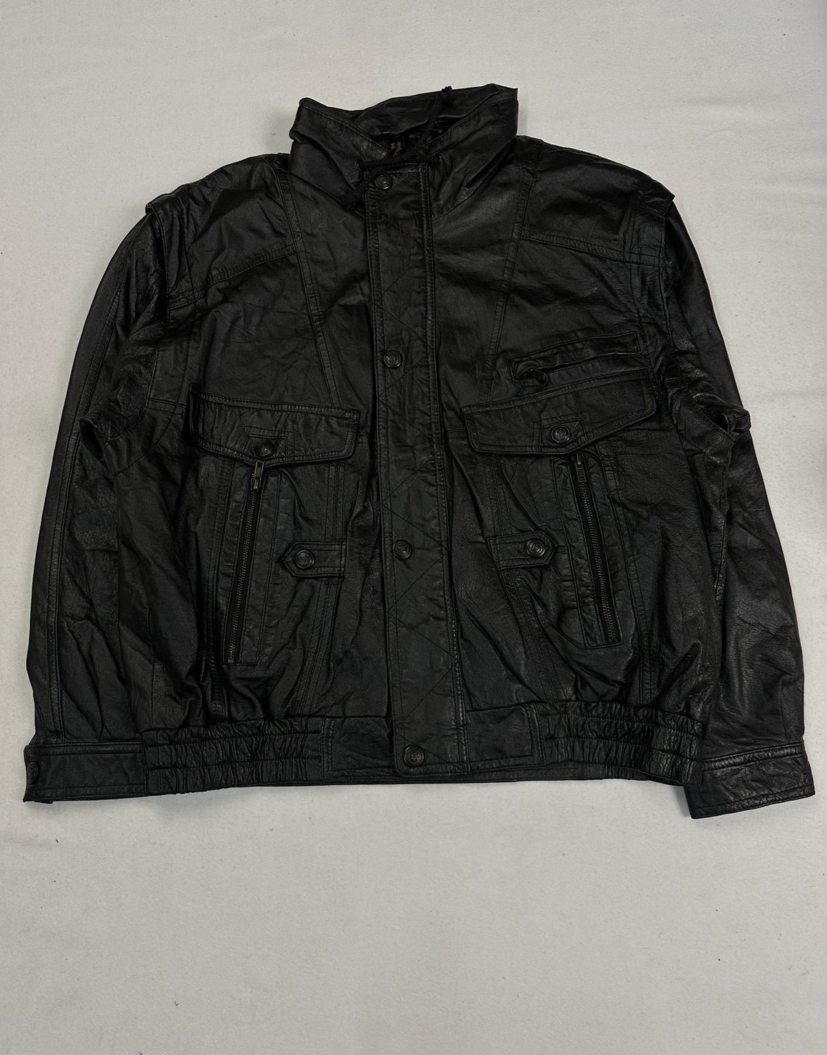 Black leather field jacket in size XL with four military style pockets