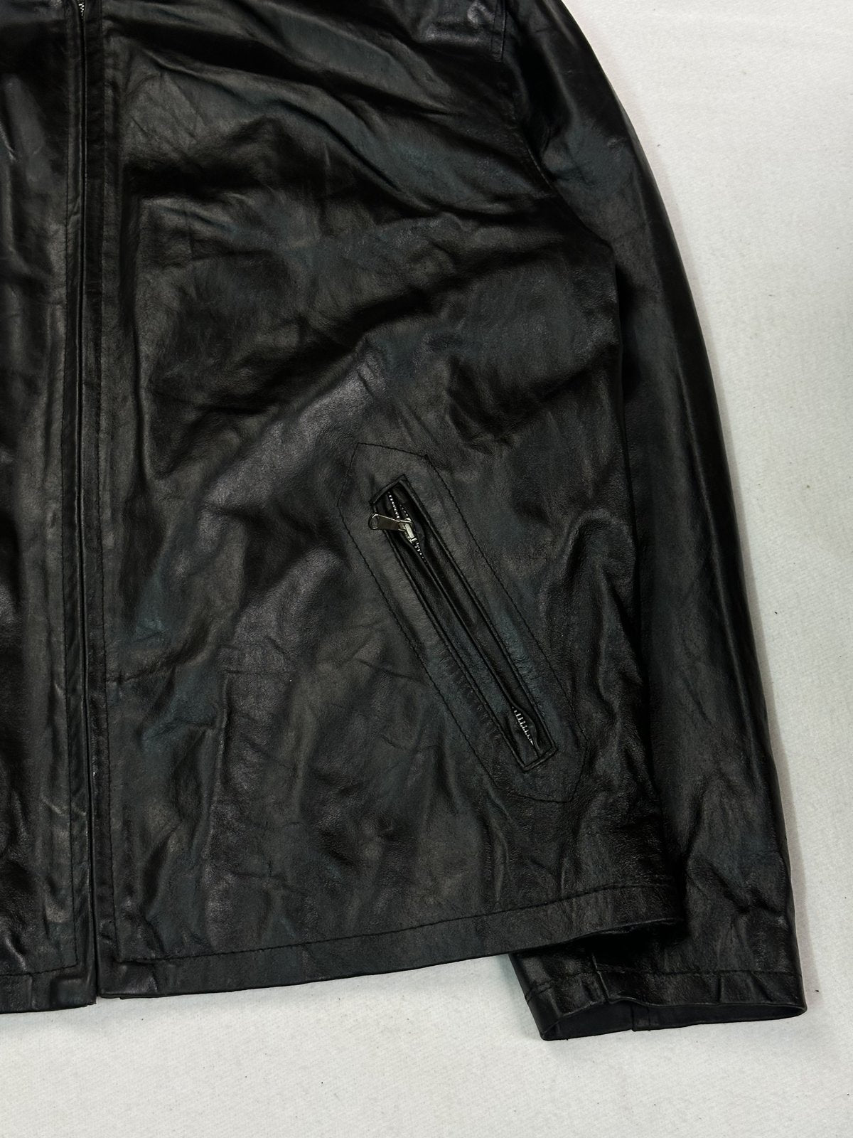 Black cafe racer jacket in very good condition, shown in size L