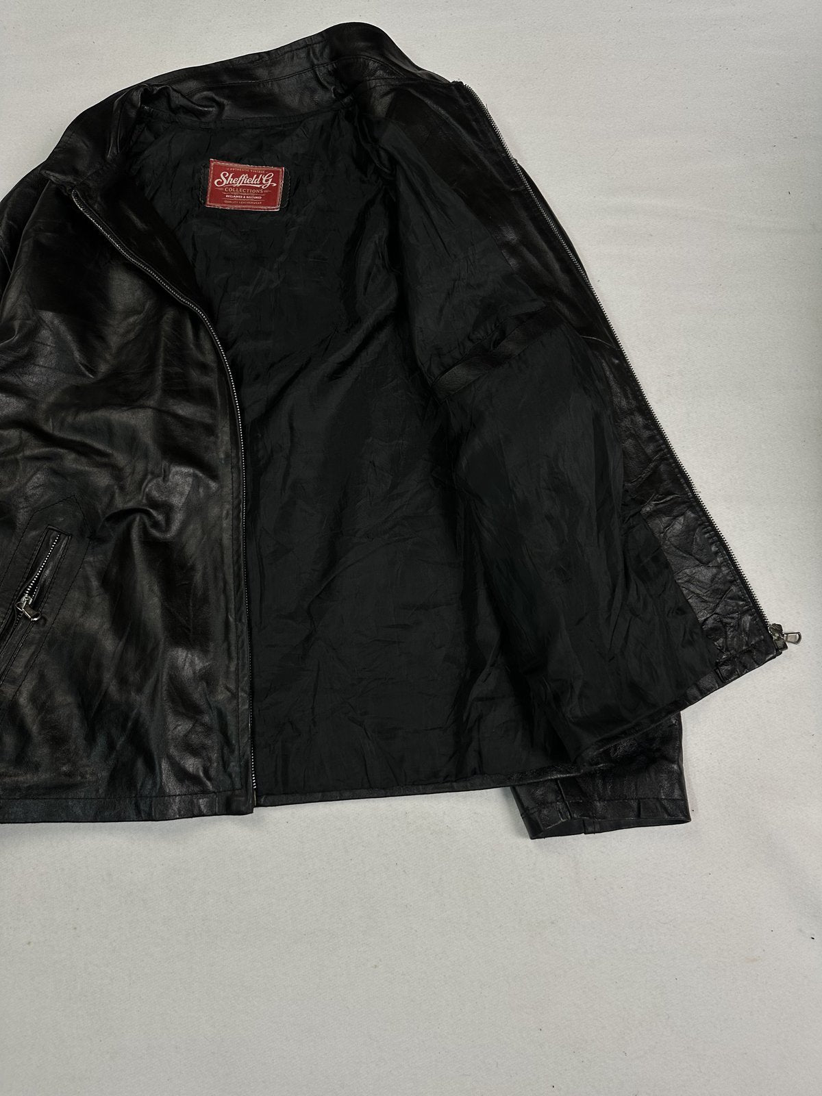 Black real leather cafe racer with a 24 inch sleeve, size L