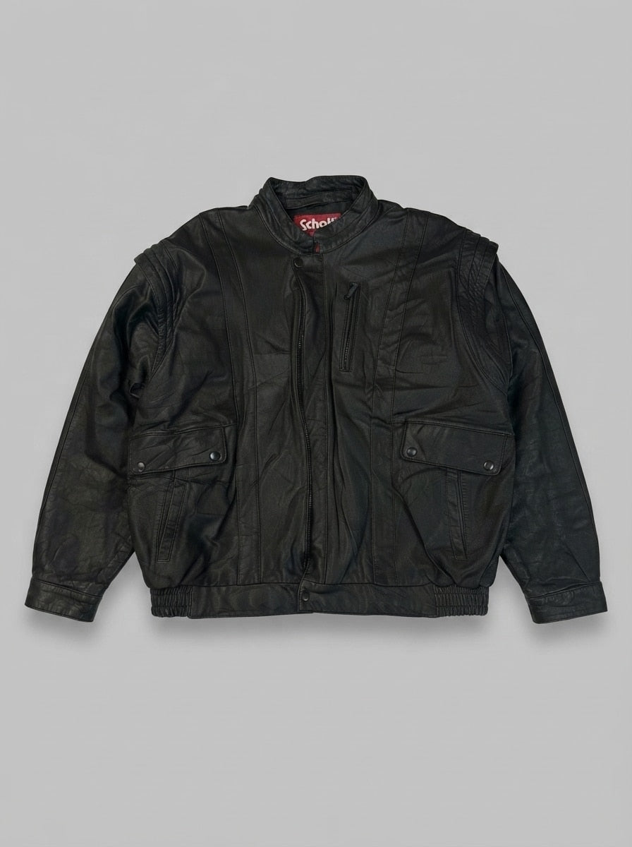 Black leather vintage jacket, size L, shown flat from the front. Flap Chest & Zip Pocket.