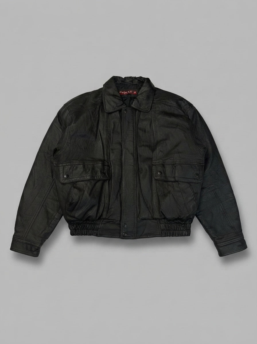 Black leather harrington jacket, size M, shown flat from the front. Point collar and chest pockets.