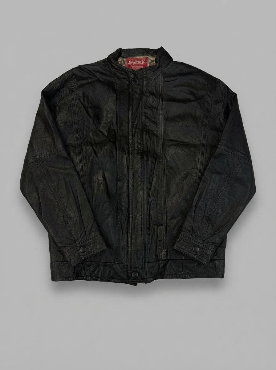 Black leather vintage jacket, size L, shown flat from the front. Snap Placket & Panelled Front.