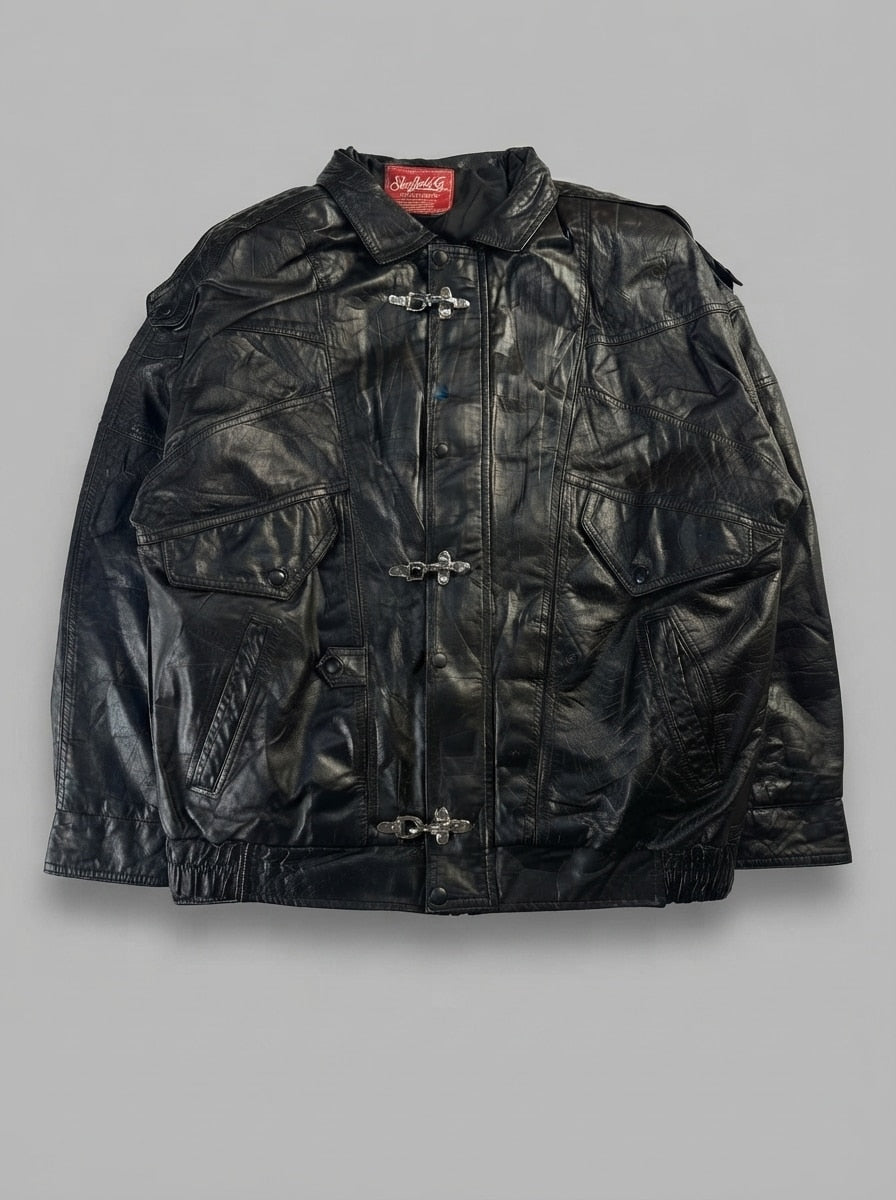 Black leather vintage jacket, size L, shown flat from the front. Three-Clasp Flap & Zip Pockets.