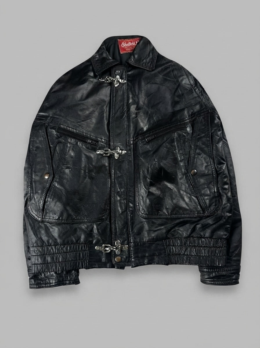 Black leather vintage jacket, size M, shown flat from the front. Chest Yoke & Three-Clasp Pockets.