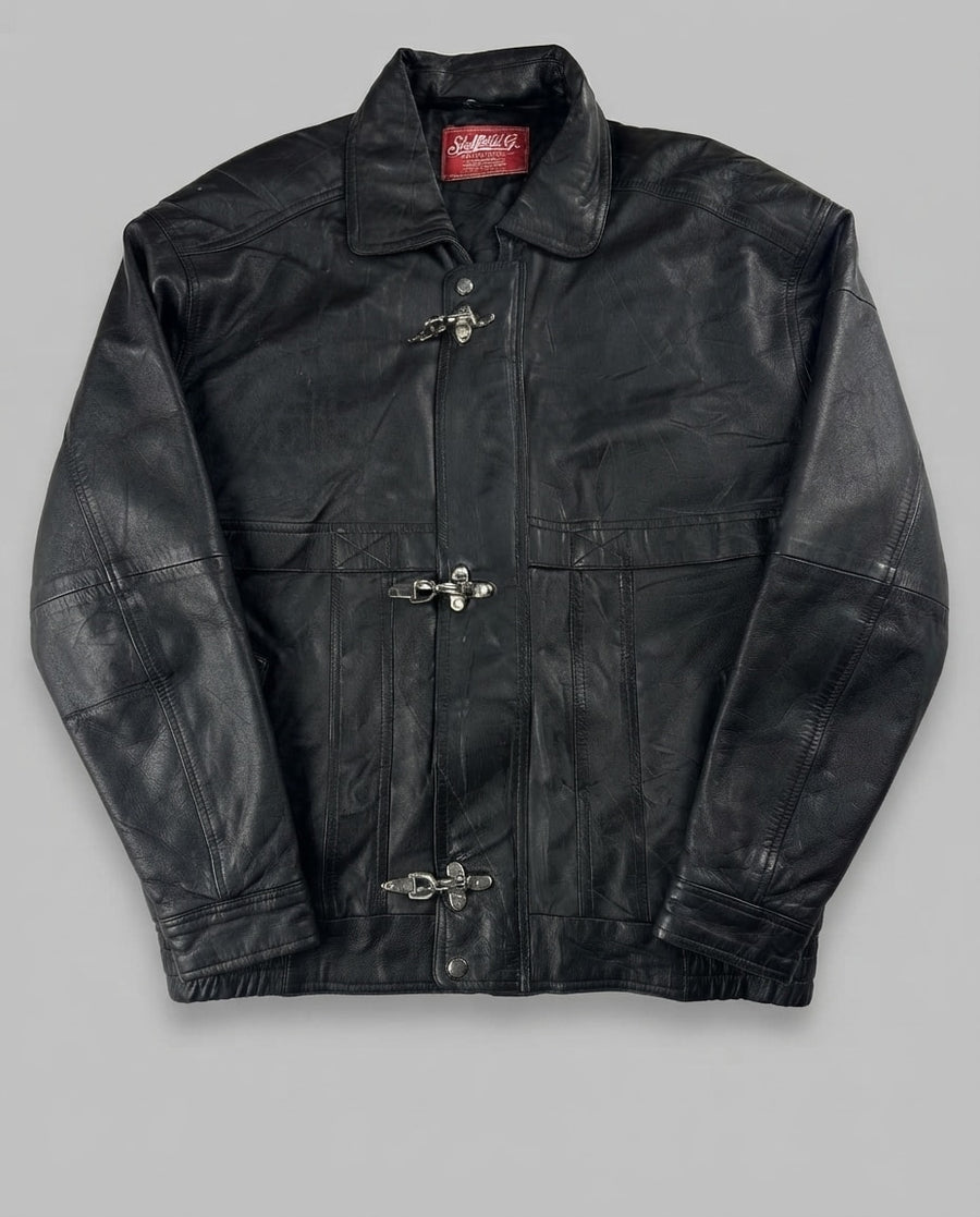 Black leather vintage jacket, size L, shown flat from the front. Panelled Body & Three Clasps.