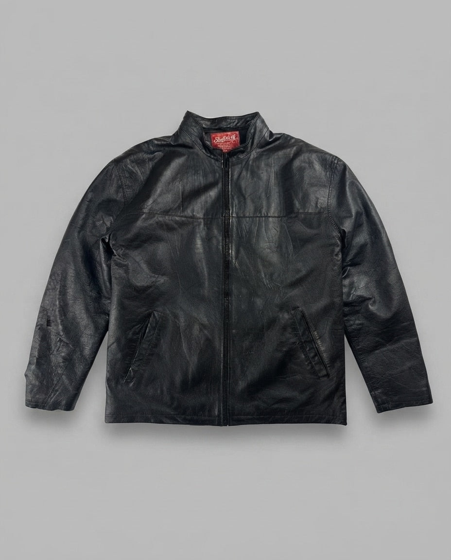 Black leather vintage jacket, size L, shown flat from the front. Chest Yoke & Slash Pockets.