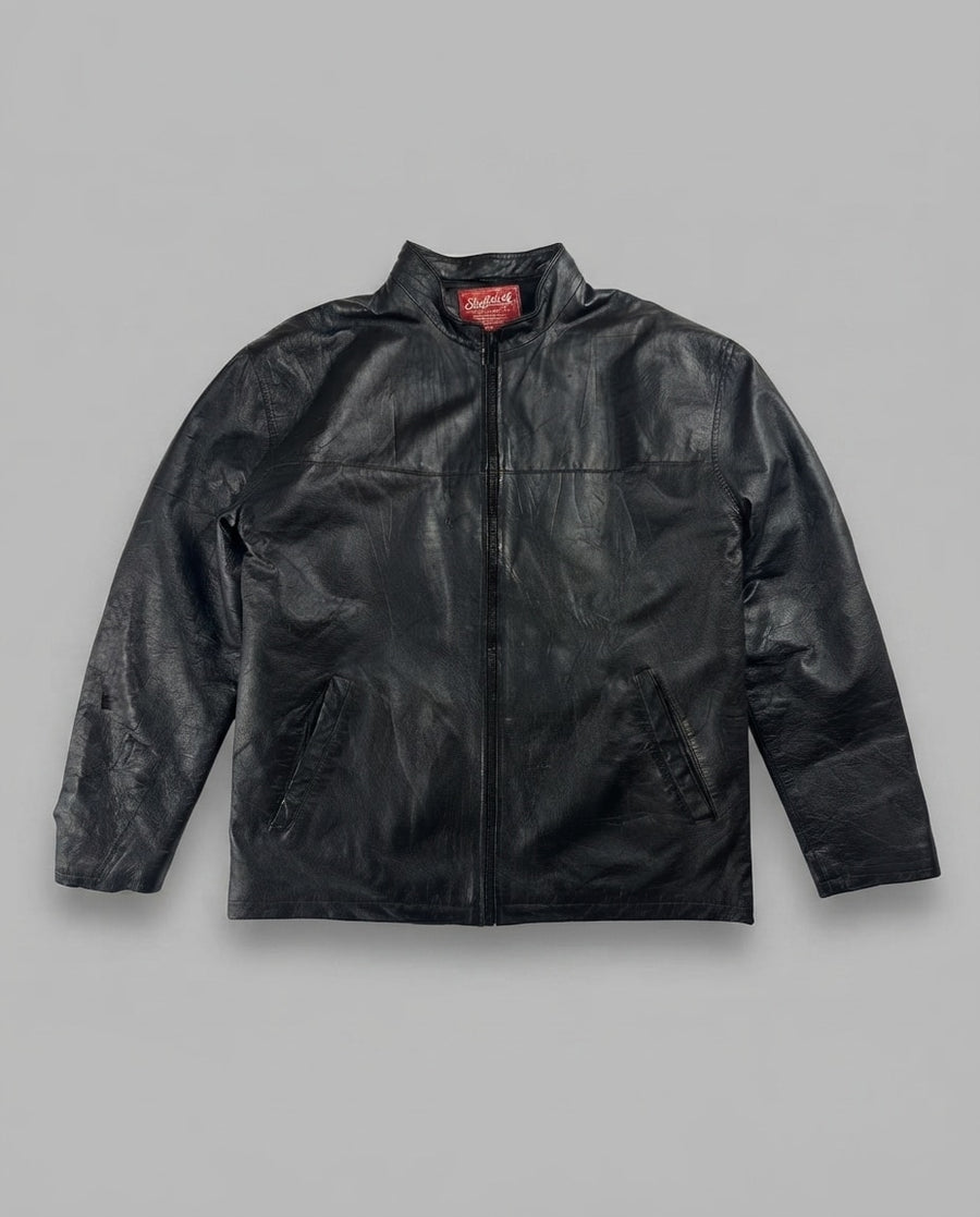 Black leather vintage jacket, size L, shown flat from the front. Chest Yoke & Slash Pockets.
