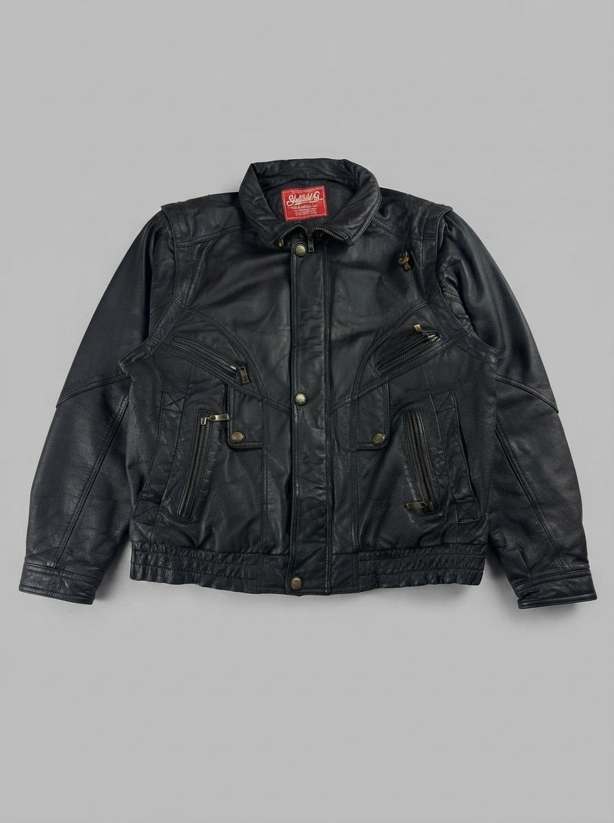 Black leather vintage jacket, size M, shown flat from the front. Chest Zip Pockets & Elastic Hem.