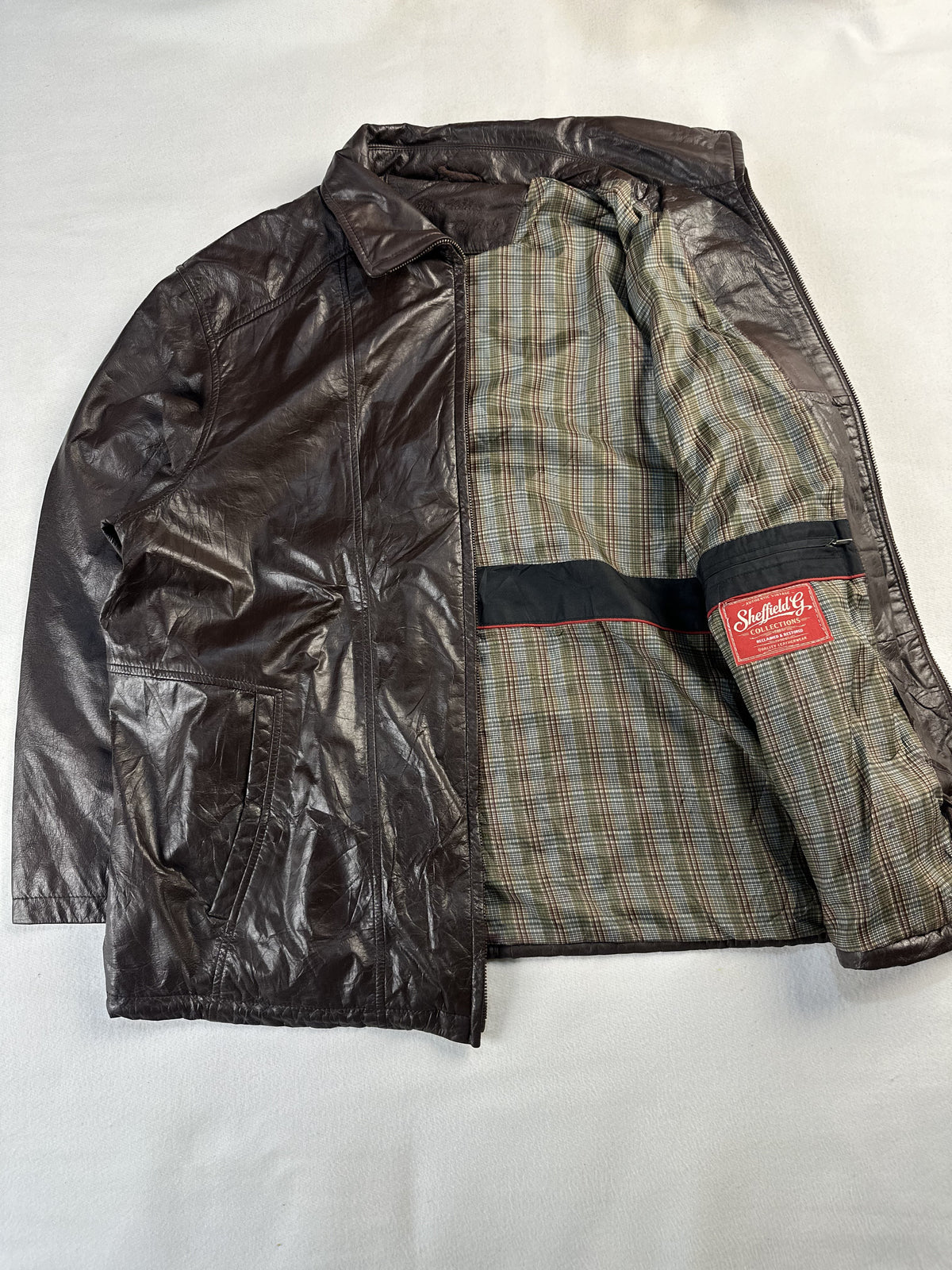 The jacket opened out flat so the checked lining runs from collar to hem