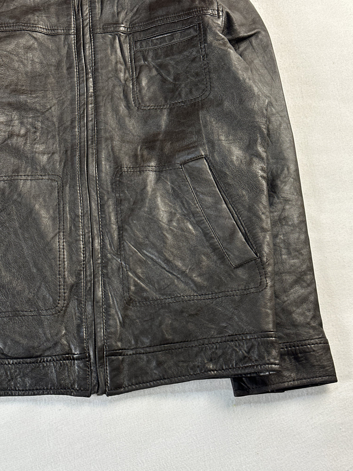 Patch chest pocket and angled hand pocket beside the front zip on the right side