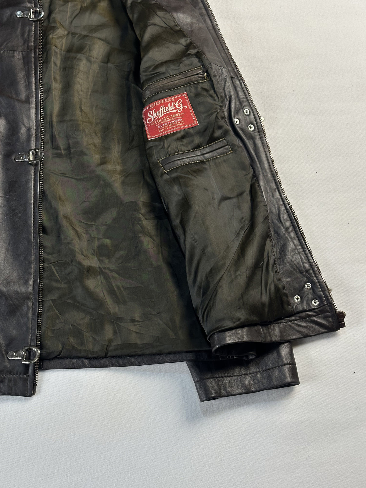 Brown real leather jacket with a 25 inch sleeve, size L