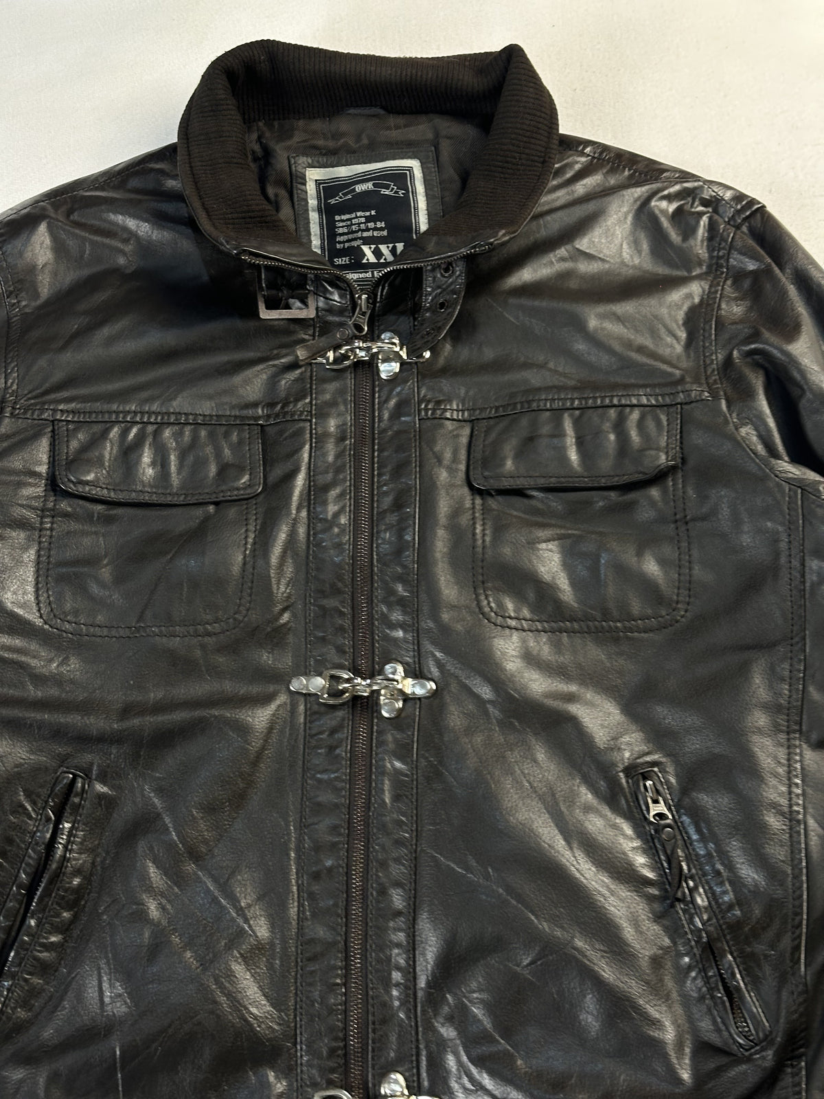 Close view of the corduroy stand collar and the hook clasps down the front