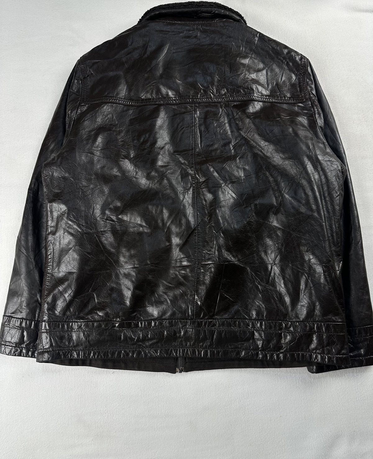 Back of the XXL brown cafe racer showing the plain leather panel and banded waist