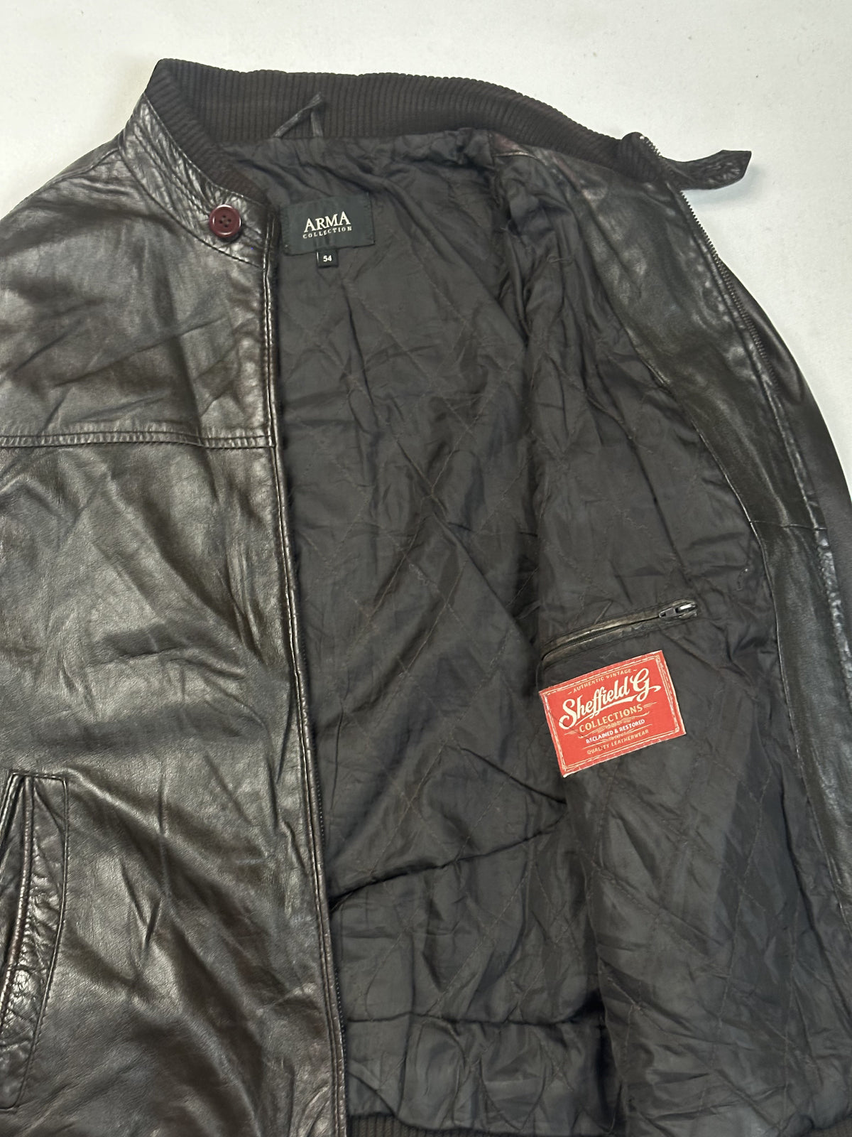 The size XL brown bomber, 26 inches long through the body