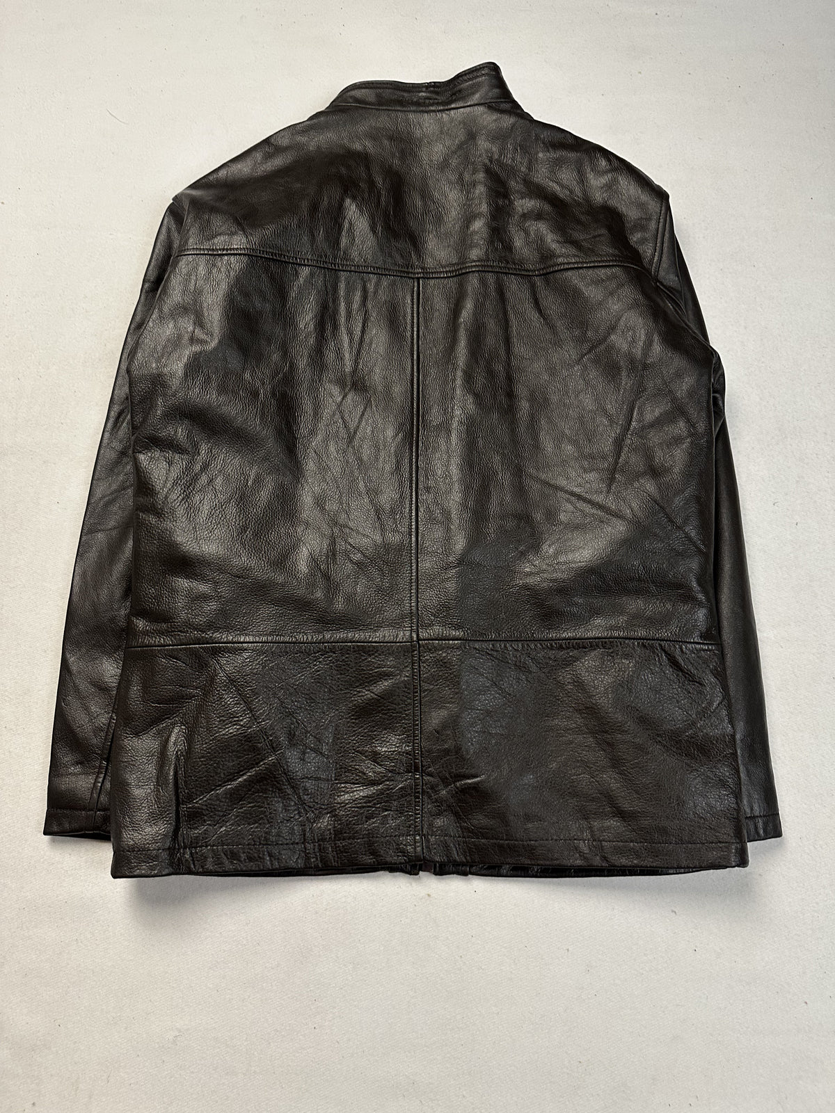 Back of the size L brown cafe racer jacket showing the plain rear panel and shoulder seams