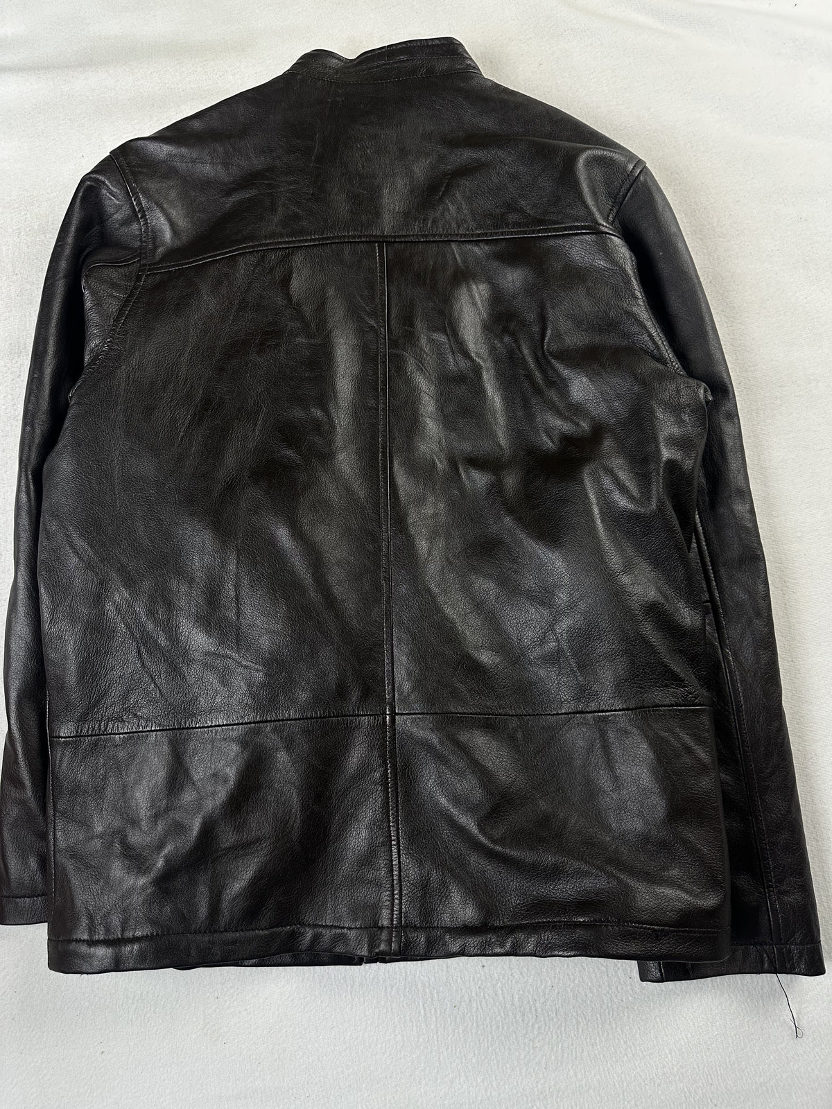 Back of the medium cafe racer laid flat, plain leather with a seam across the shoulders