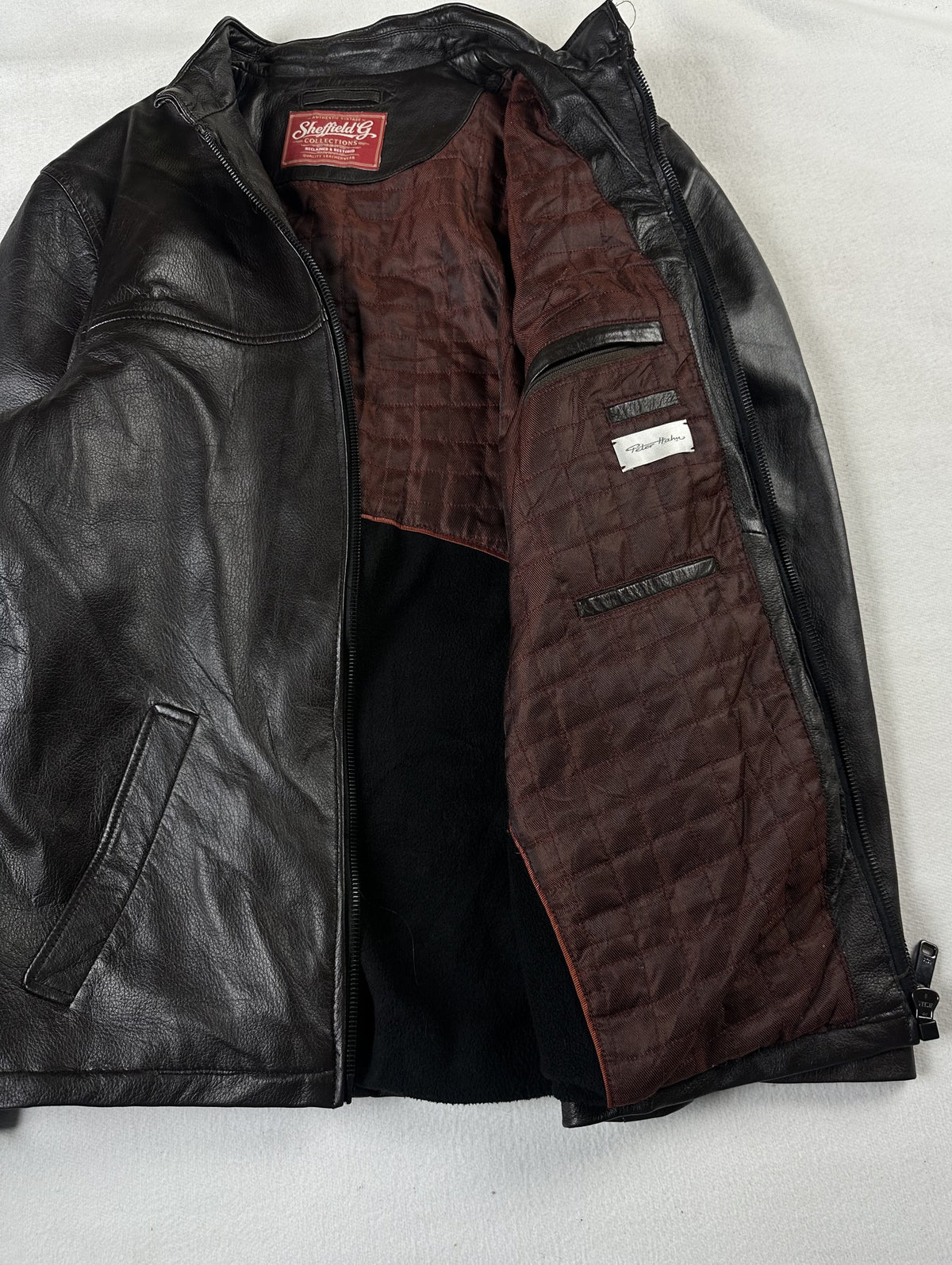 The cafe racer opened right out to show the full burgundy quilted lining