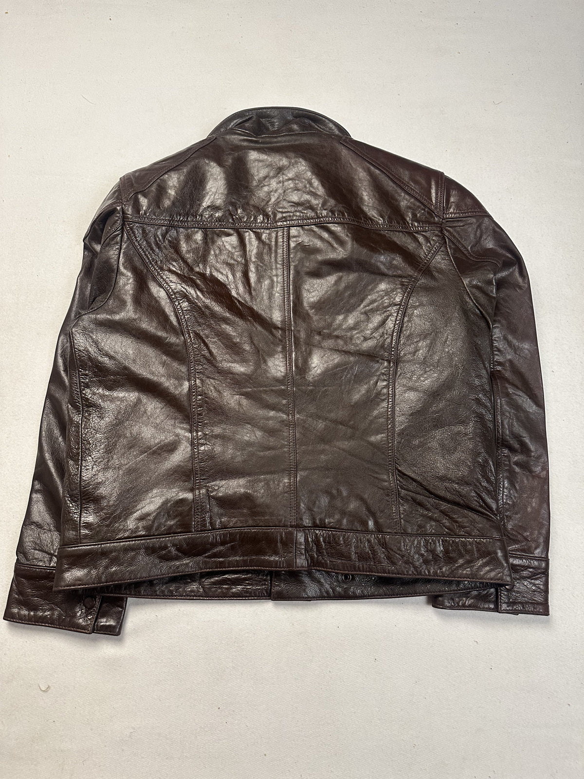 Brown leather field jacket in size L shown from the front with toggle clasps