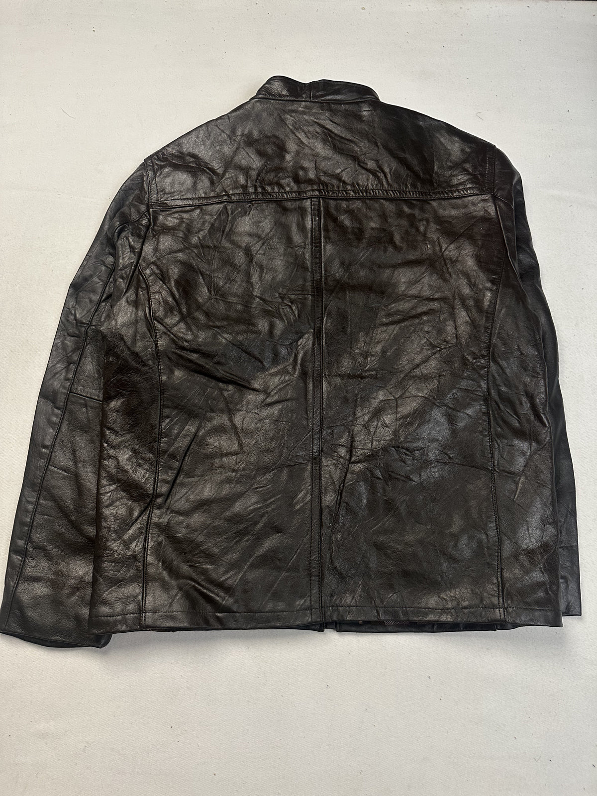 Back of the XL brown cafe racer laid flat showing the yoke seam across the shoulders