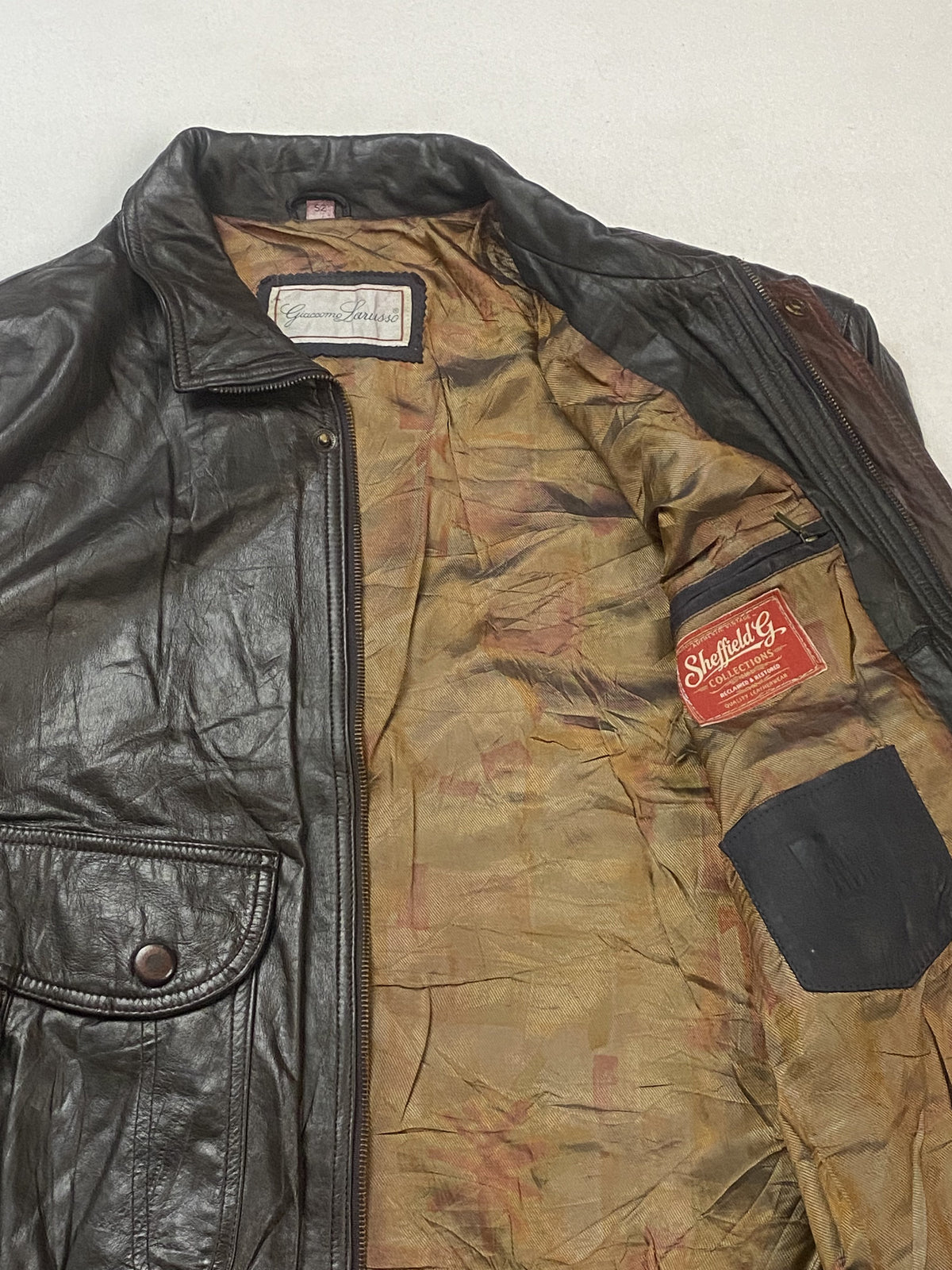 Closer look at the camouflage-print lining and the stitched inner labels