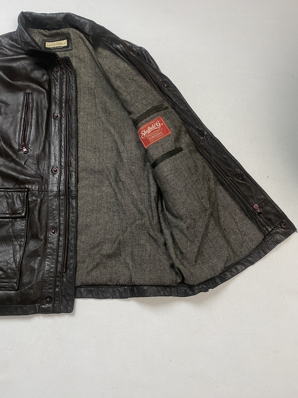 Brown real leather field jacket with a 26 inch sleeve, size XL