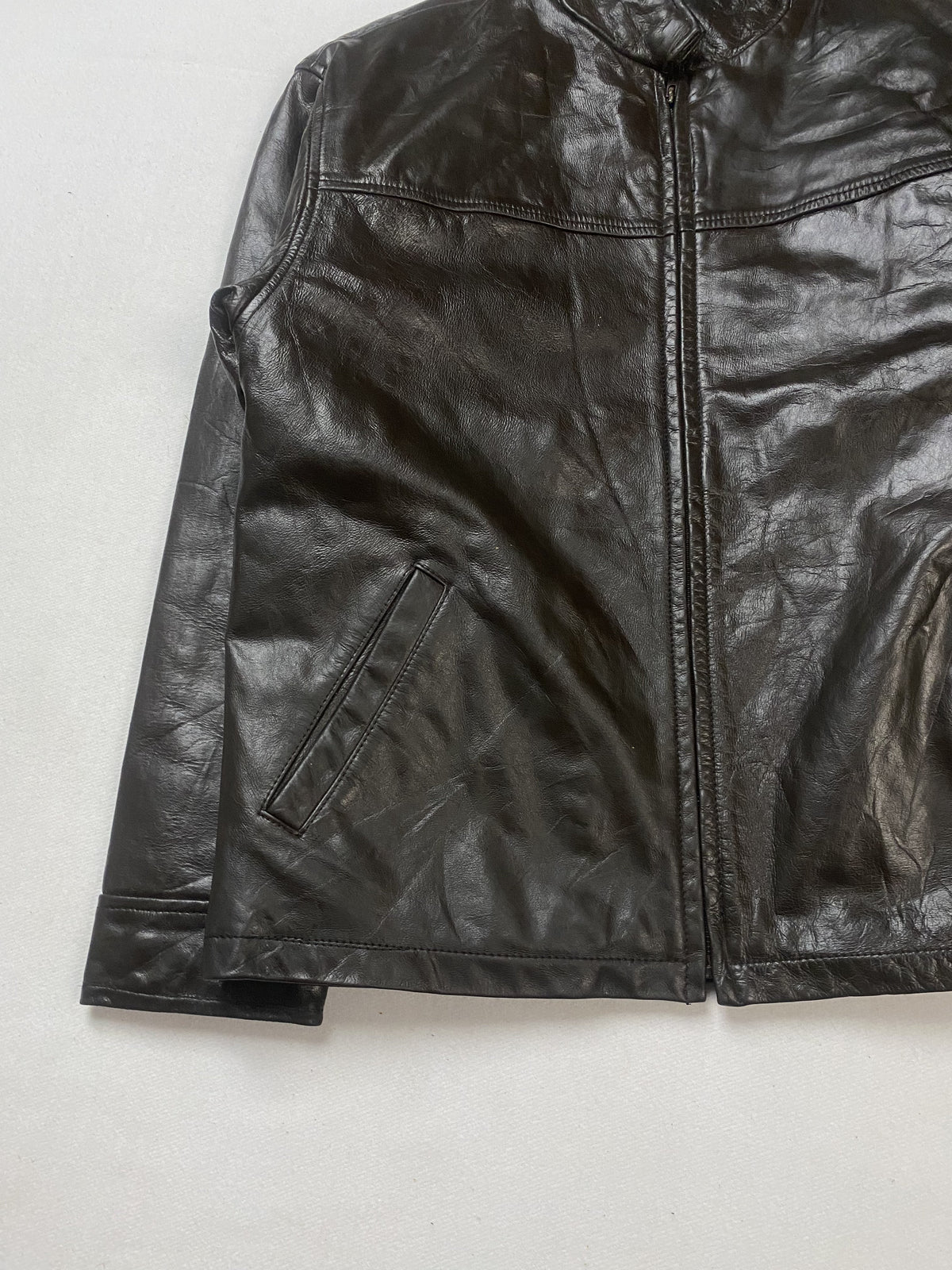 Brown leather cafe racer jacket in size L shown from the front