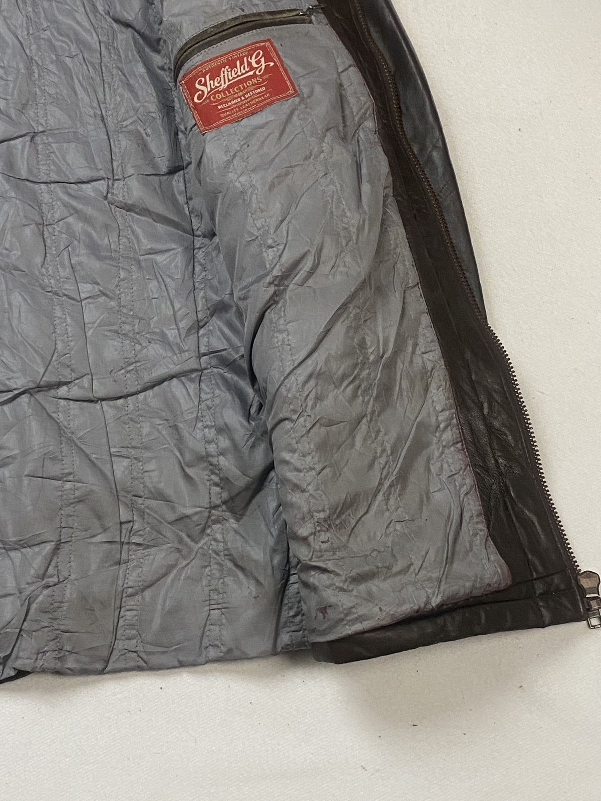 Brown real leather jacket with a 25 inch sleeve, size L